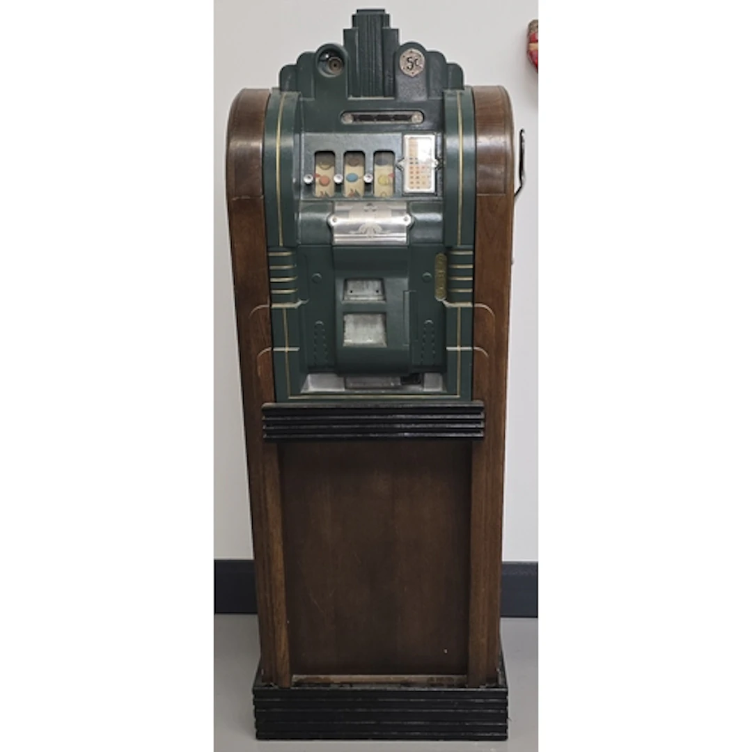 A vintage Mills Extraordinary Console slot machine. Circa 19...