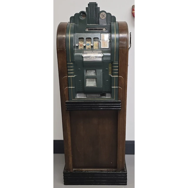 A vintage Mills Extraordinary Console slot machine. Circa 19...
