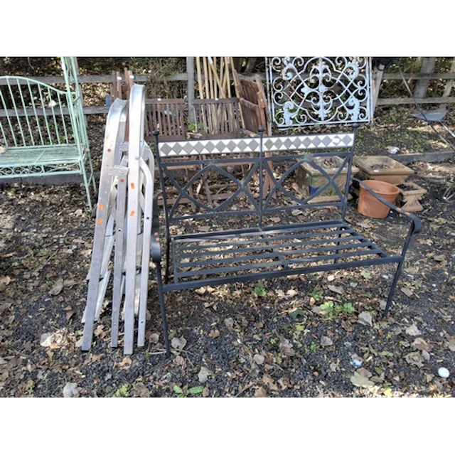 A MODERN STEEL GARDEN BENCH WITH TILED FRIEZE TO BACK and tw...