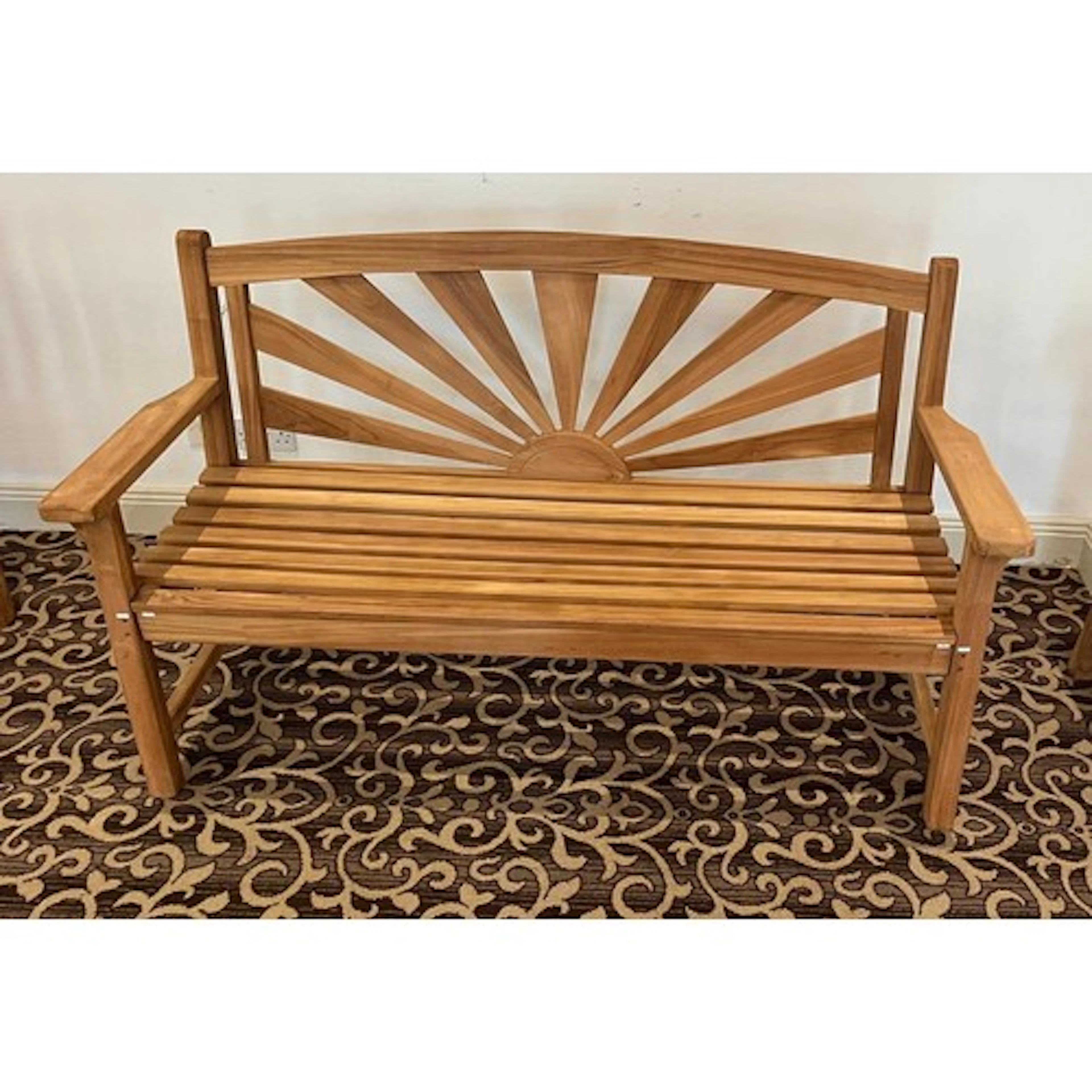 A good Teak three seater Bench with a sunburst back. This it...
