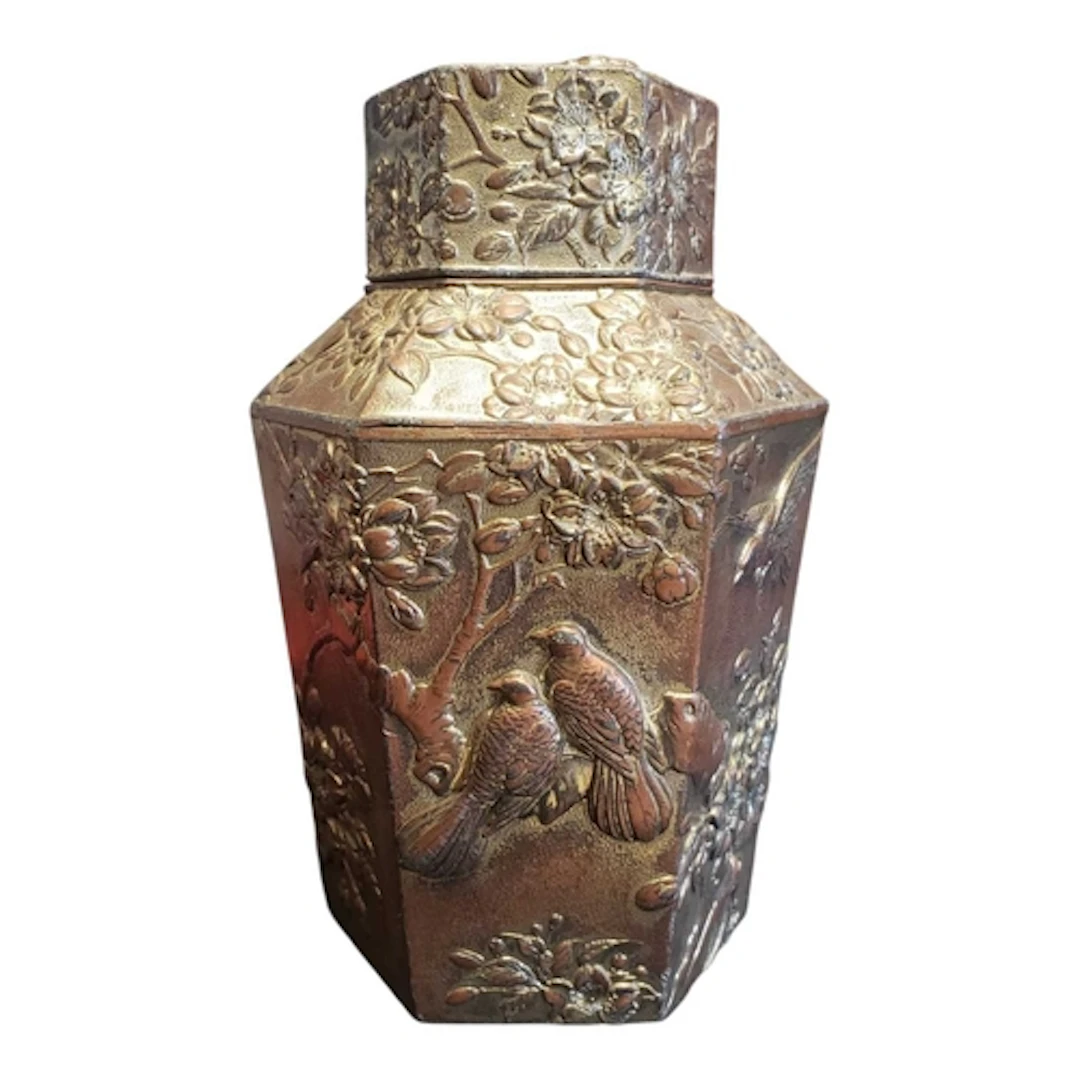 A 20th century Japanese metal tea caddy. The tea caddy featu...
