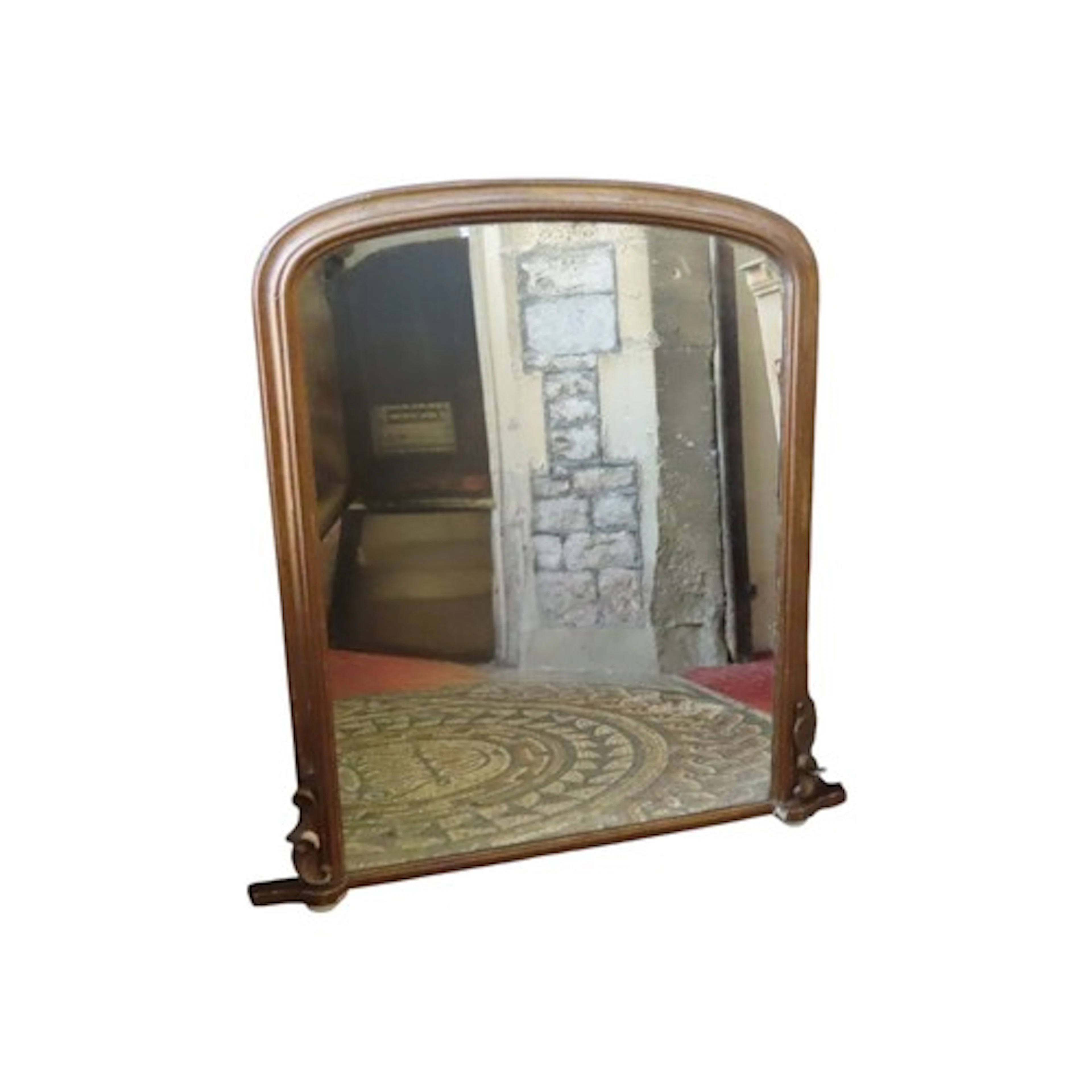 A Victorian arched gilt framed over mantle wall mirror raise...