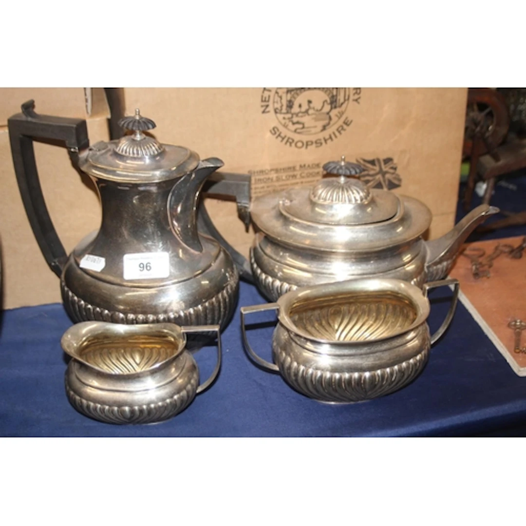 Silver plated four-piece half gadrooned tea set.