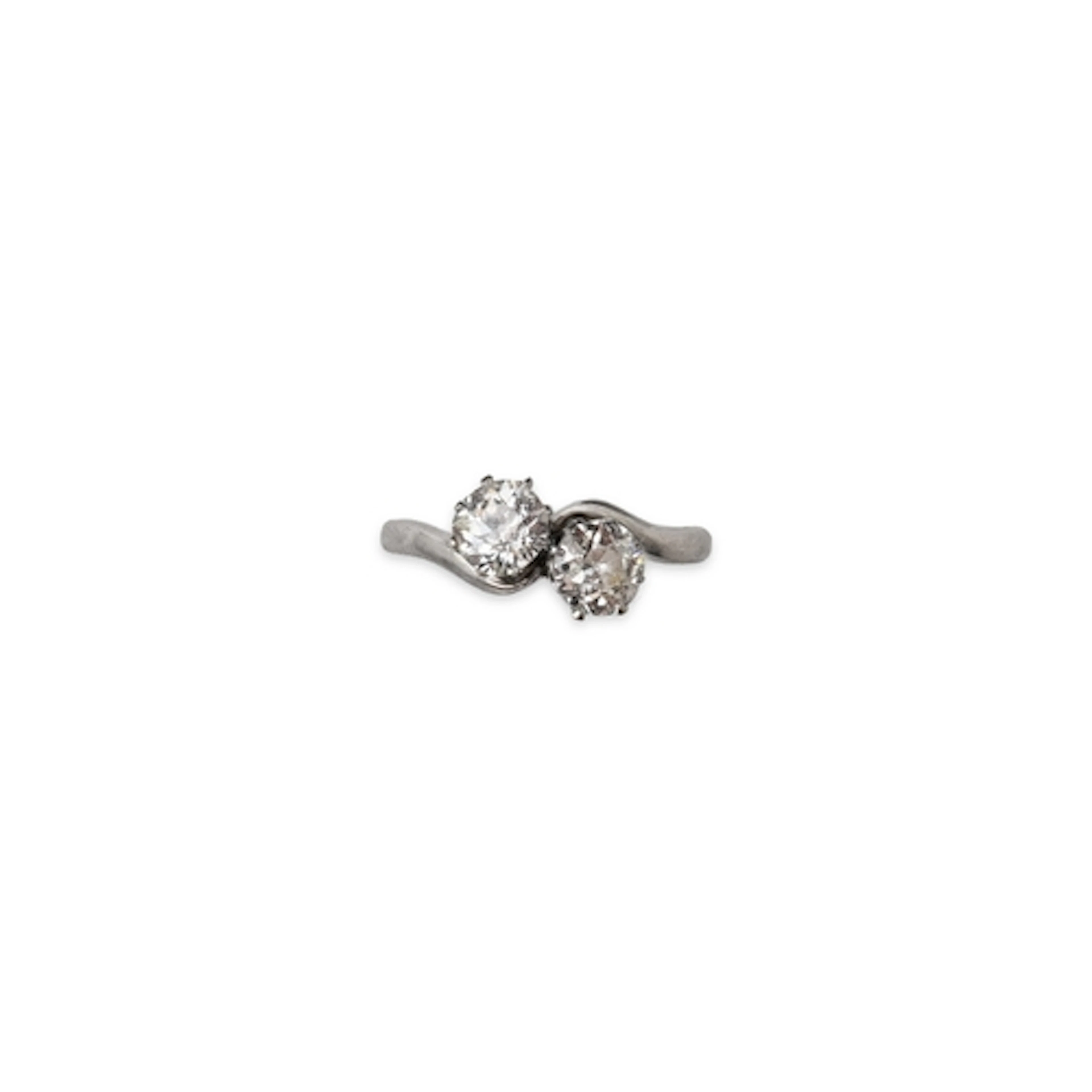 A diamond 'toi-et-moi' ring, early 20th century, set with a ...