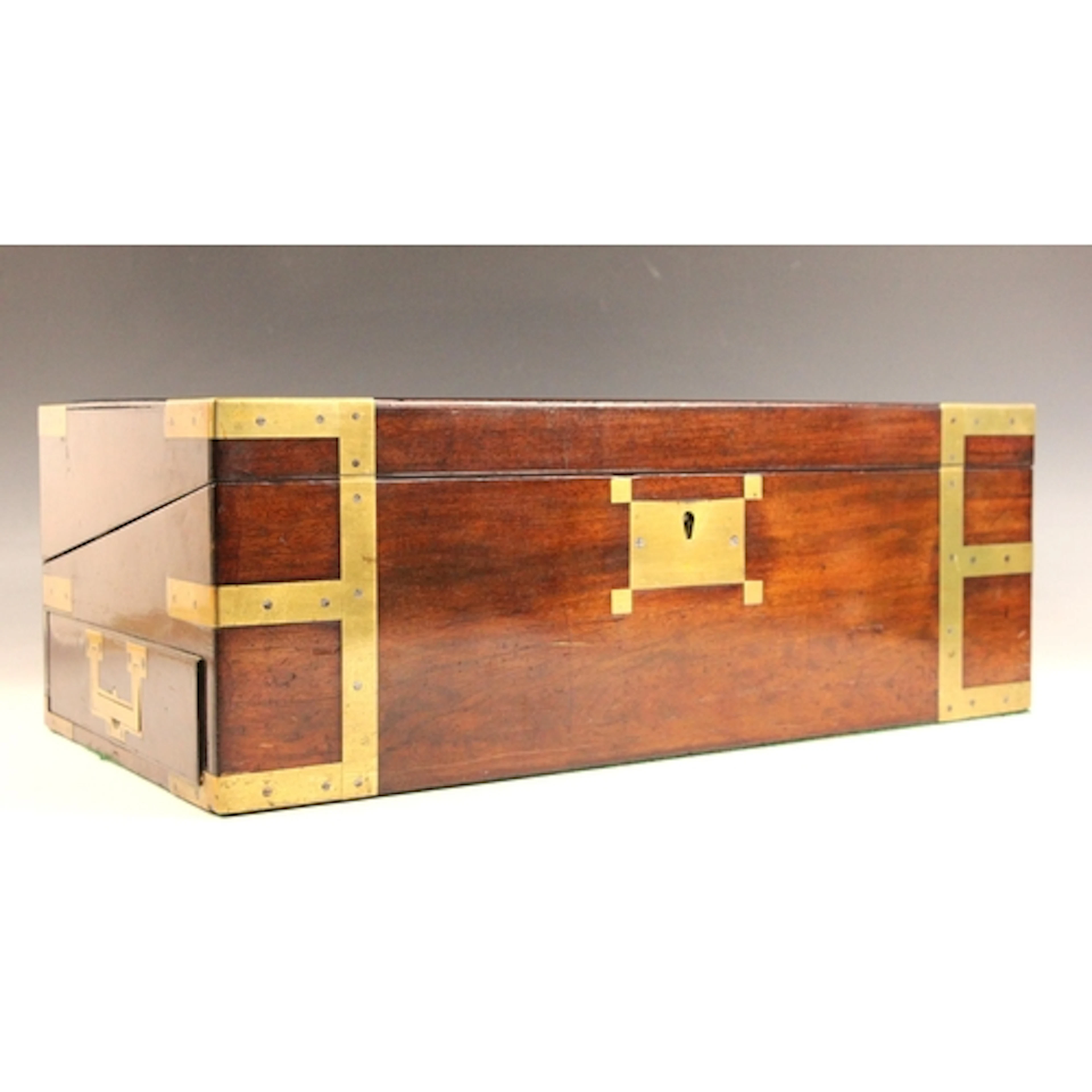 A large mahogany and brass bound campaign style writing slop...