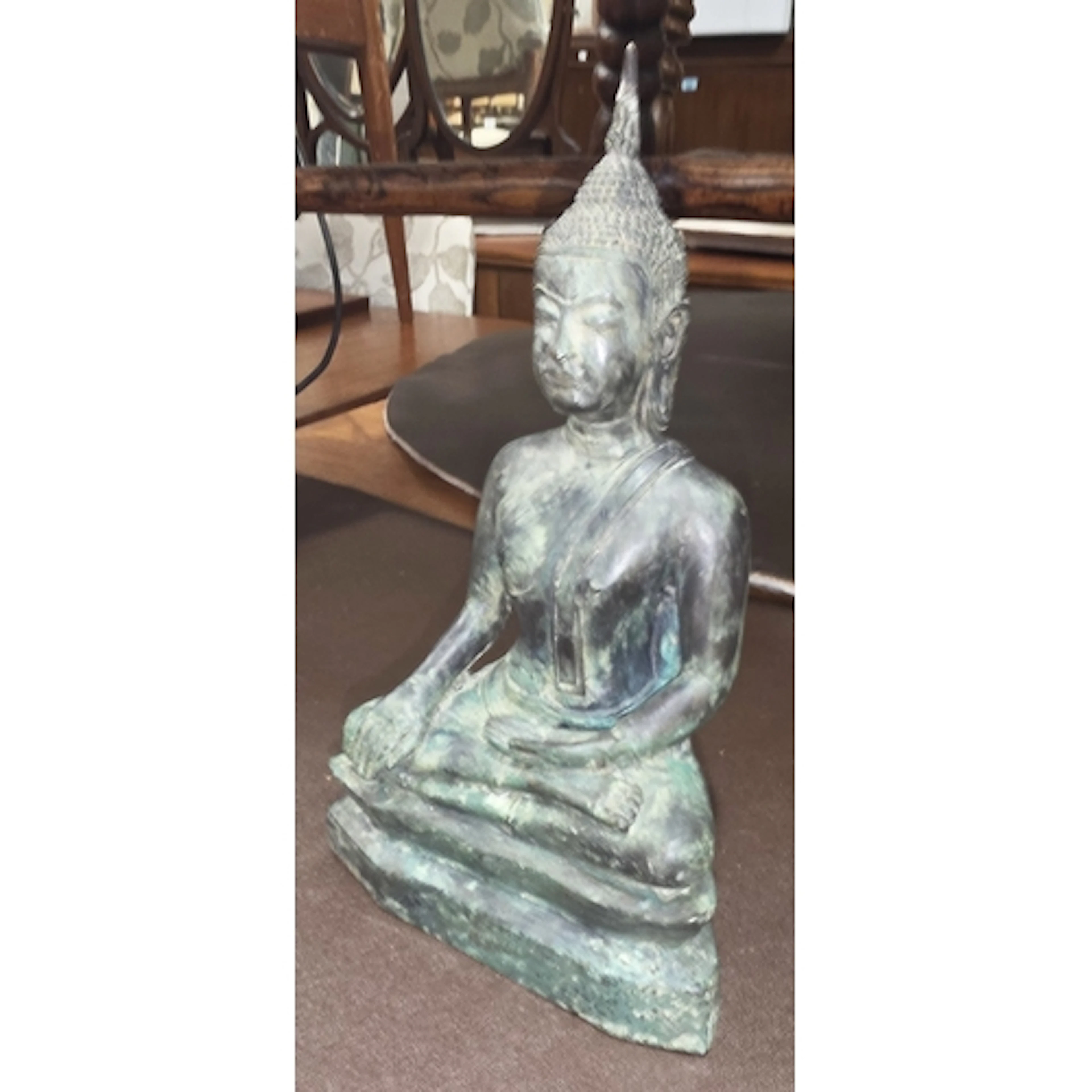 A late 19th/early 20th century Far Eastern Buddha seated in ...