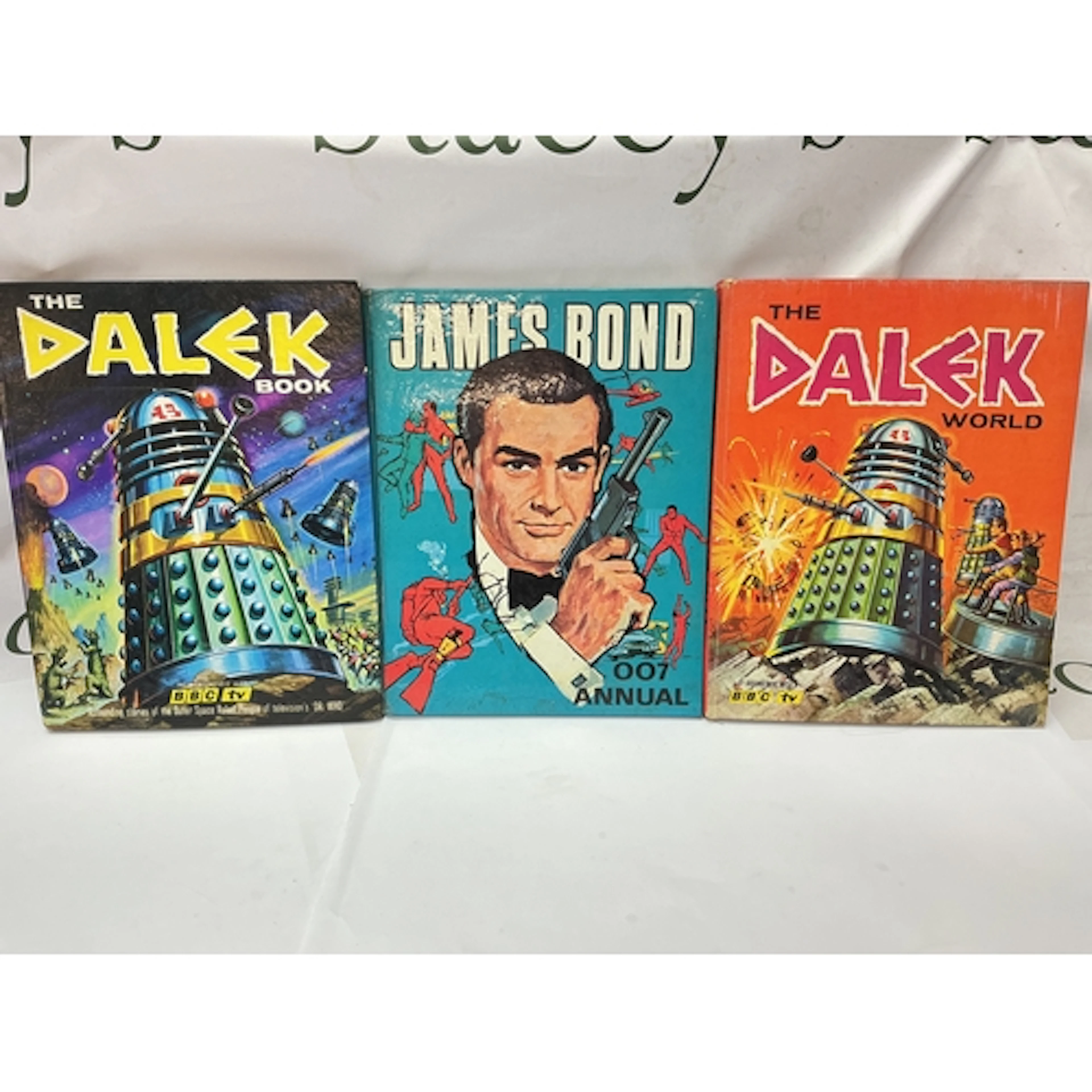 2 Early Doctor Who Dalek Annuals And A James Bond Annual.