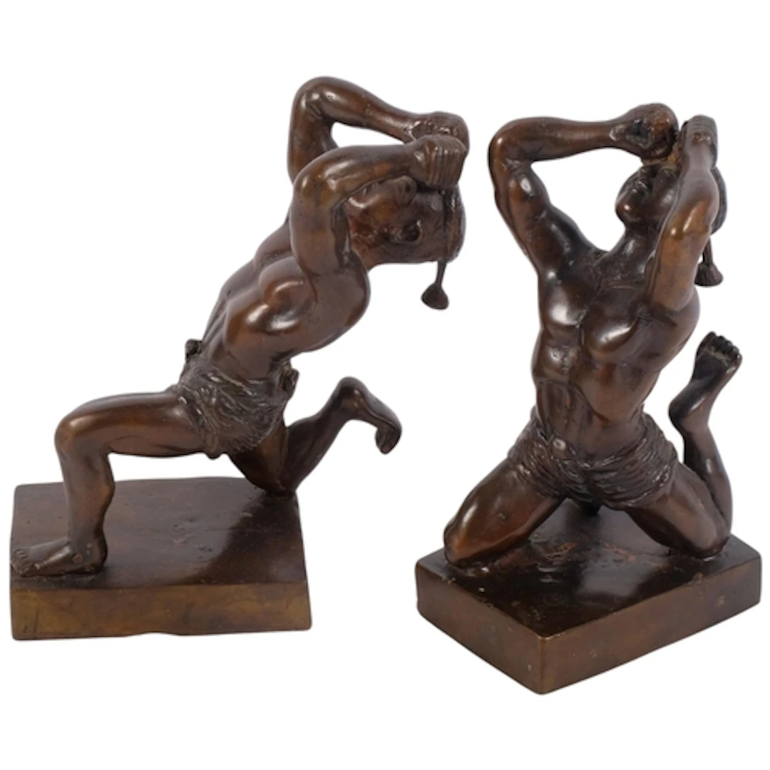 A pair of Oriental bronze sculptures of boxers, on plinths, ...