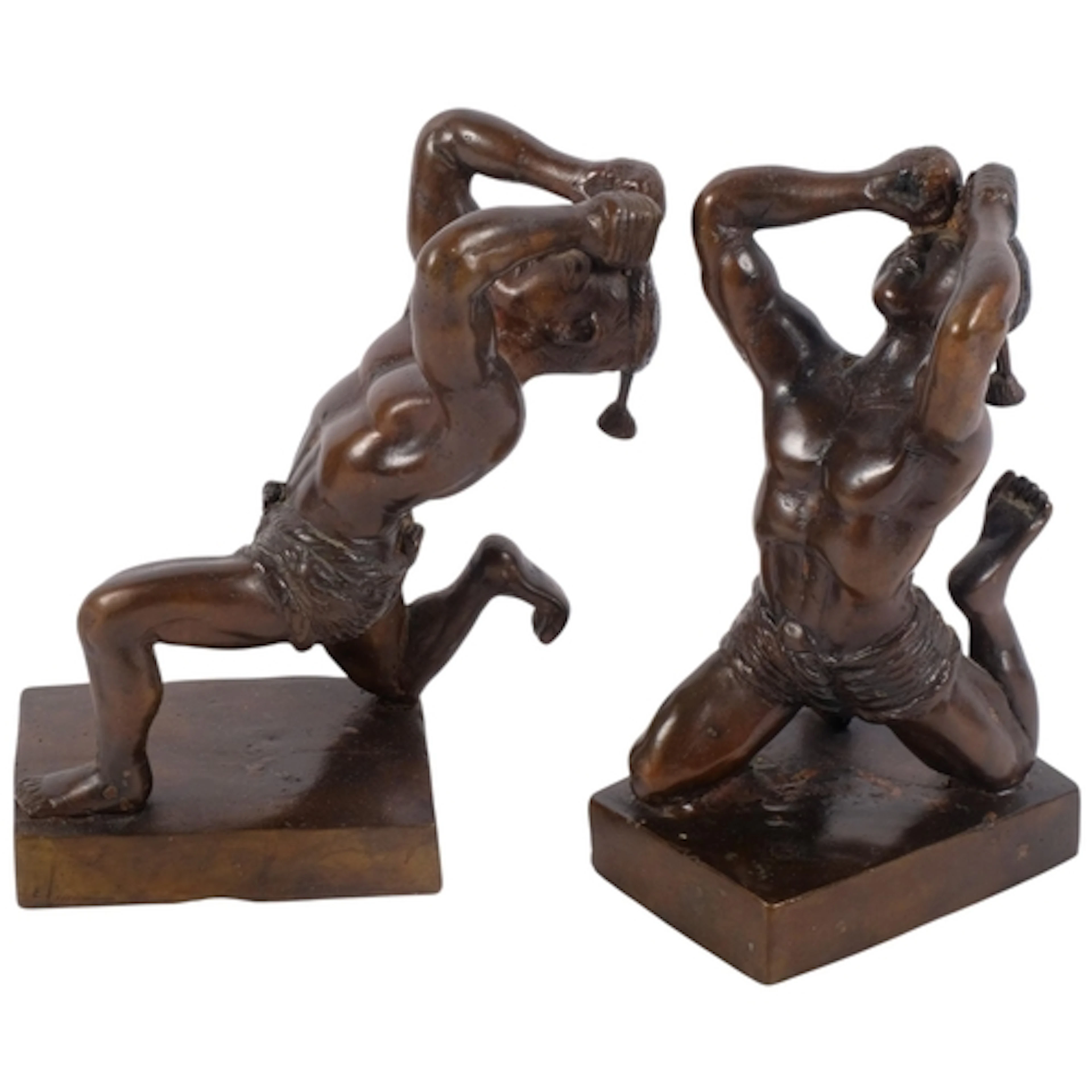 A pair of Oriental bronze sculptures of boxers, on plinths, ...