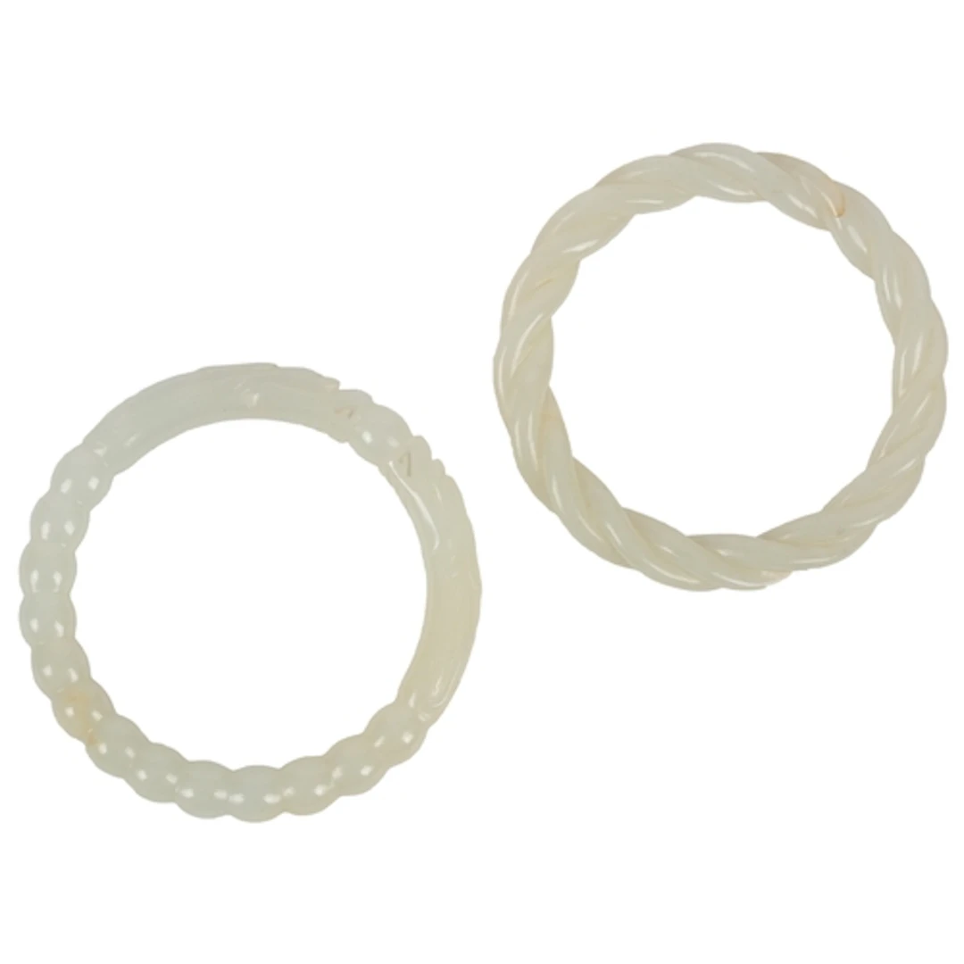 Two Chinese white jade bangles, 19th/20th century, the first...