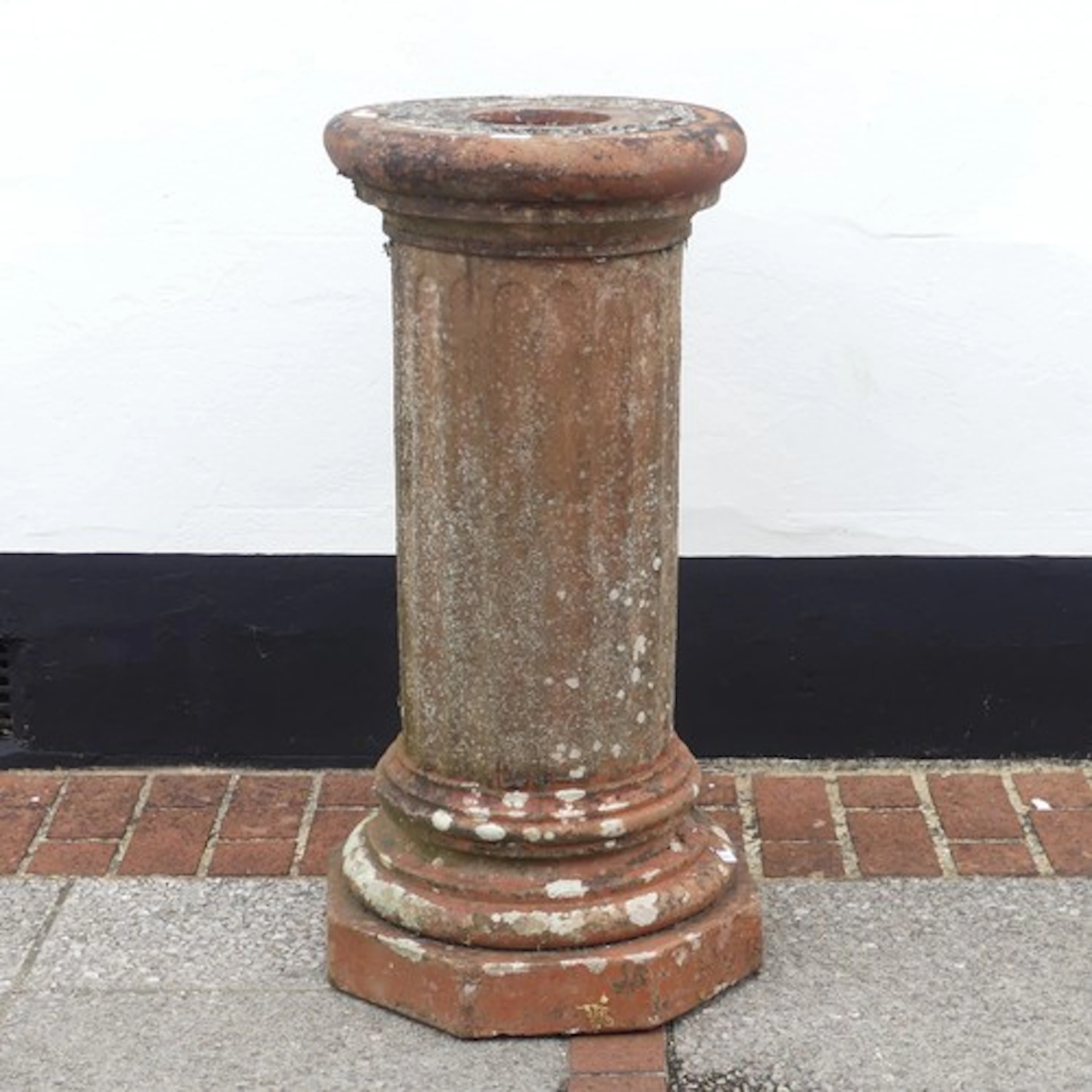 An antique weathered terracotta fluted Garden Column, diamet...