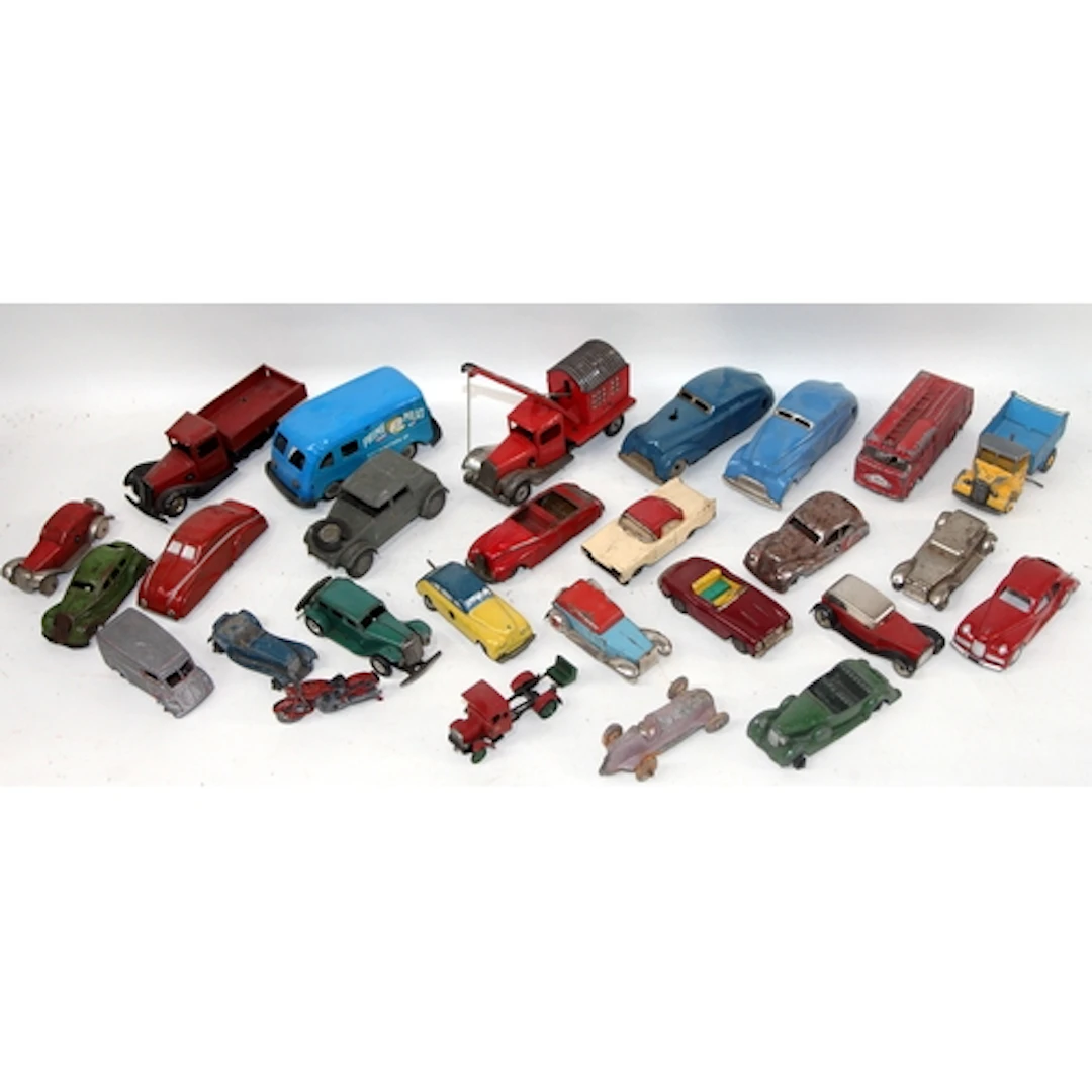 A collection of vintage tin plate and die cast vehicles, Kem...