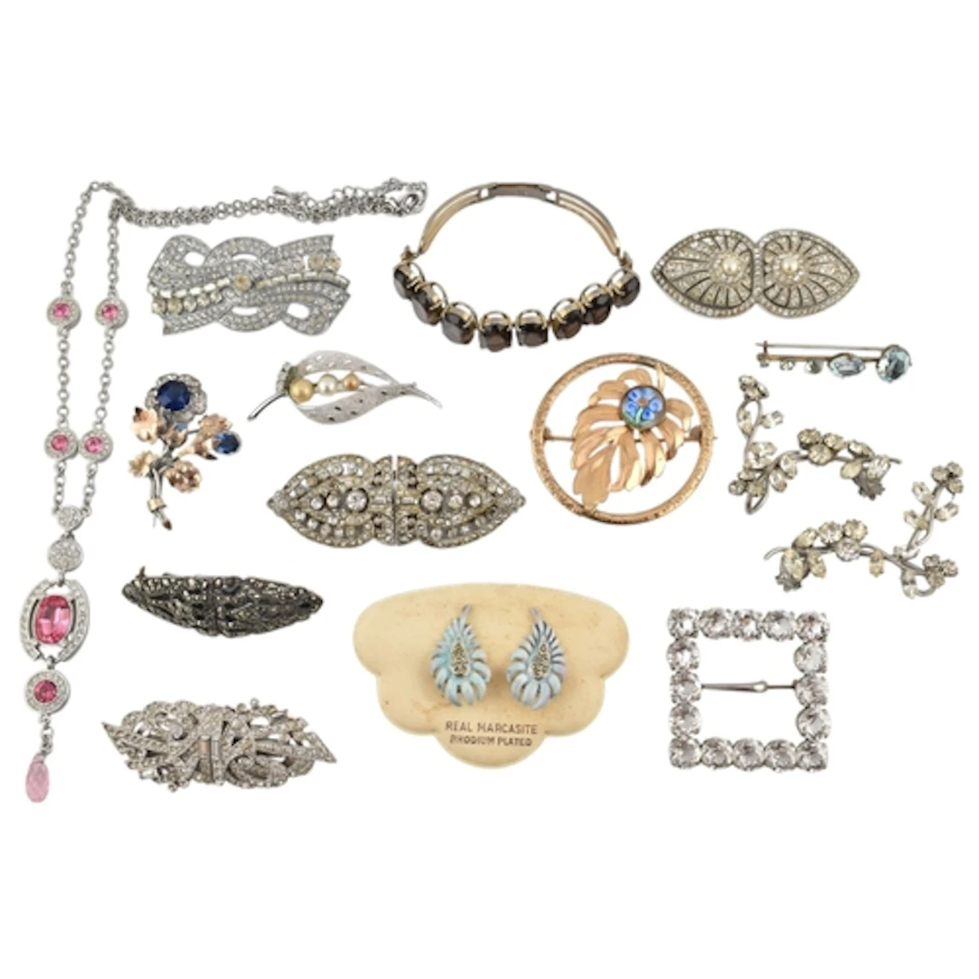 Collection of brooch pins, bracelets and clip-on earrings. A...
