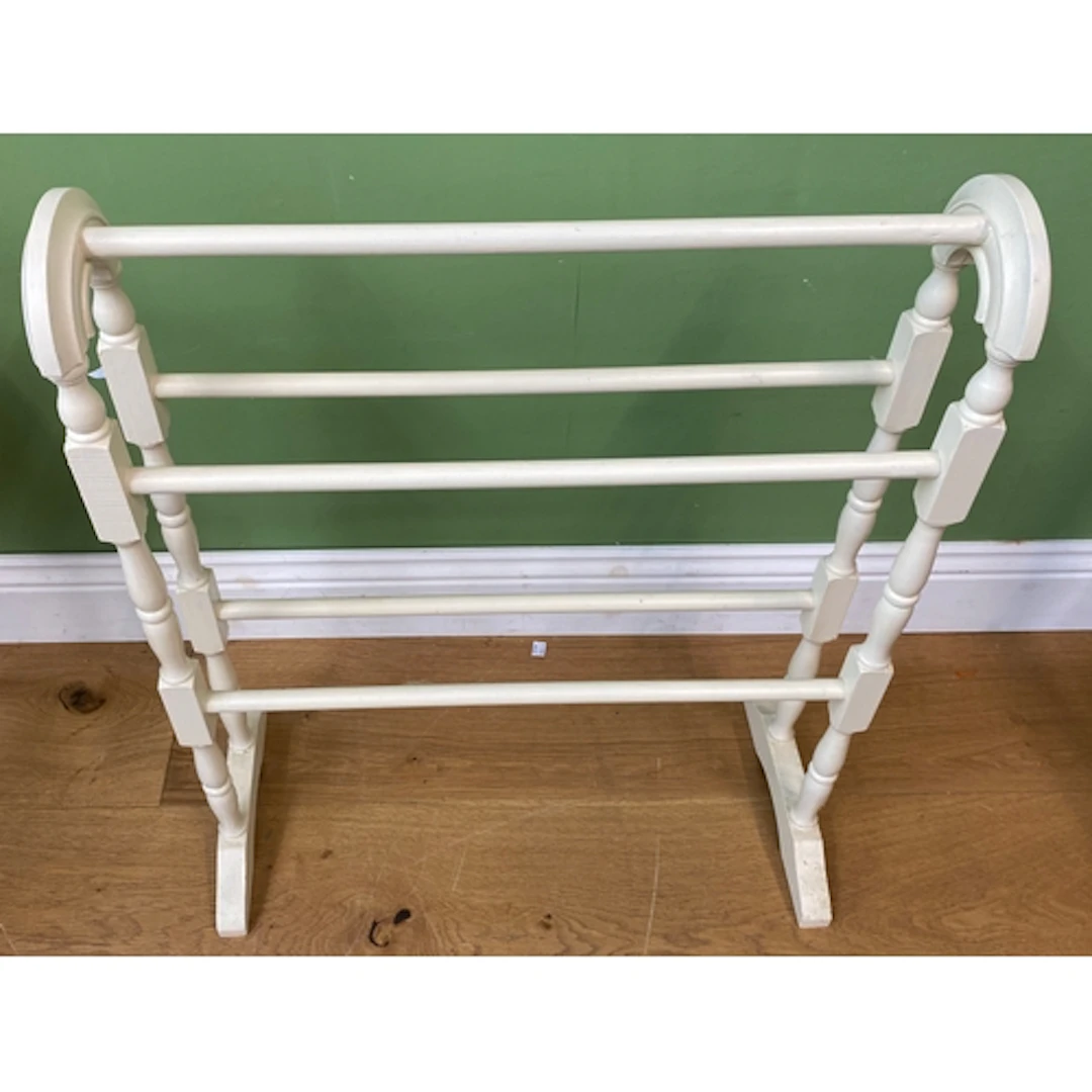 A white painted towel rail, 64cmW