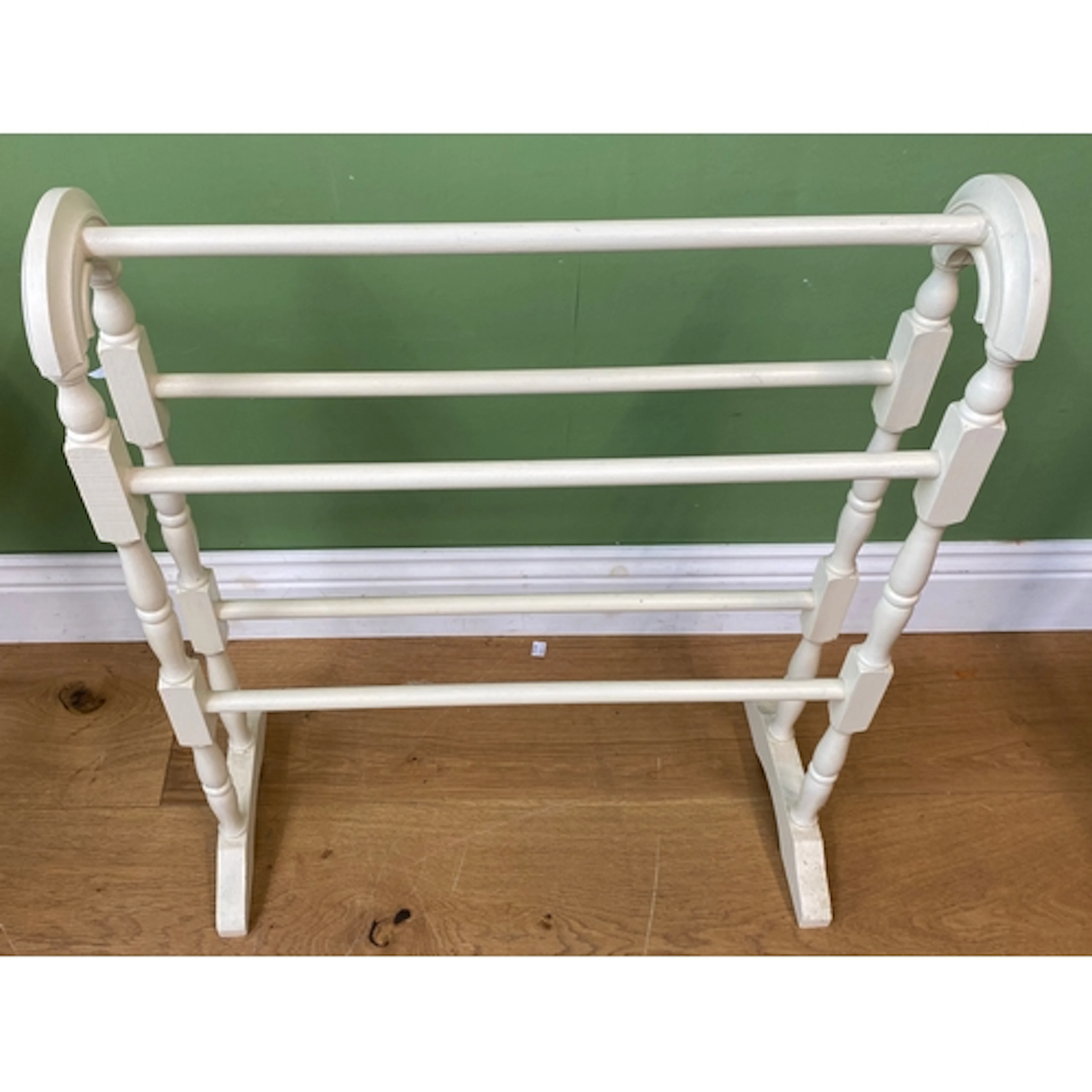 A white painted towel rail, 64cmW