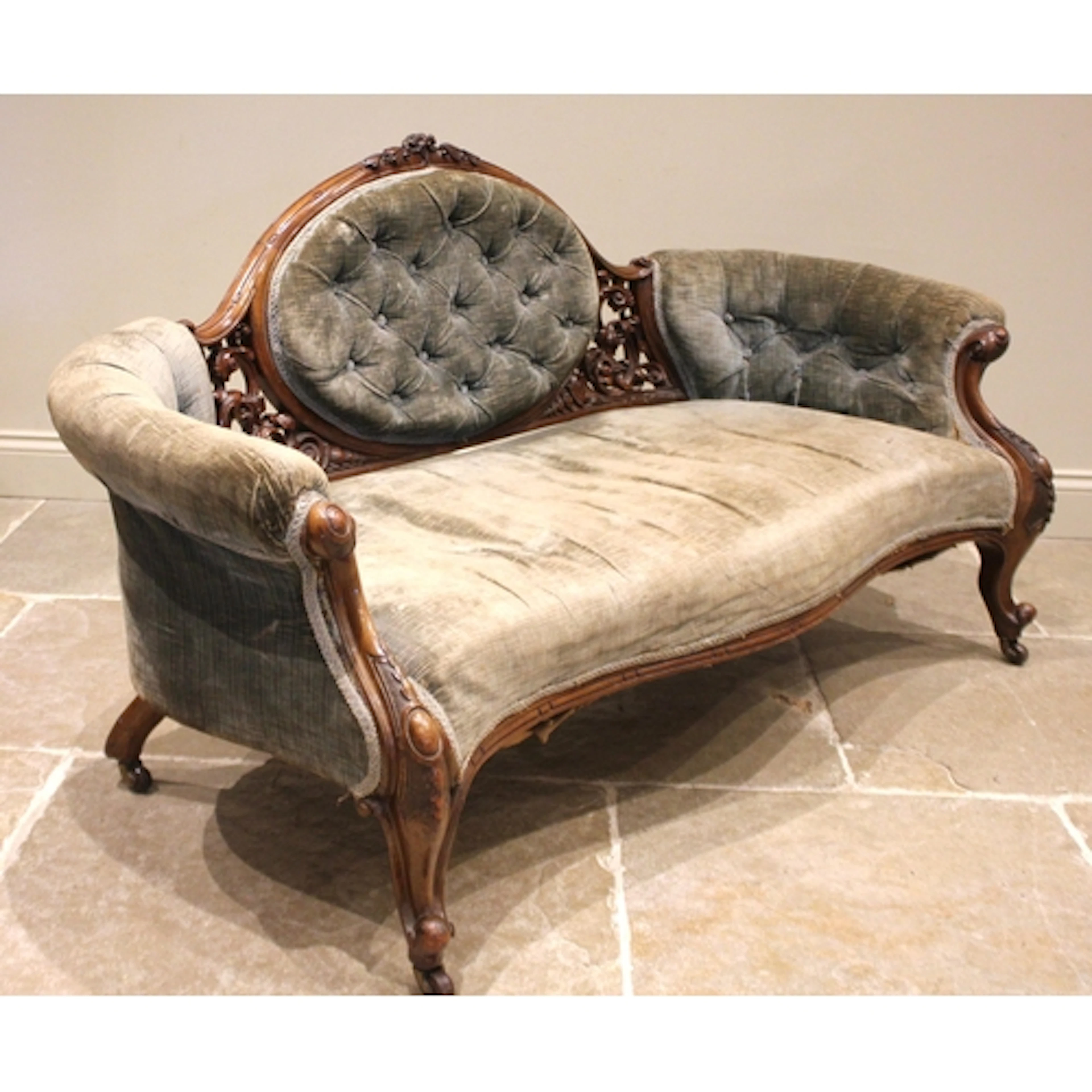 A Victorian walnut framed boudoir sofa, the cameo back exten...