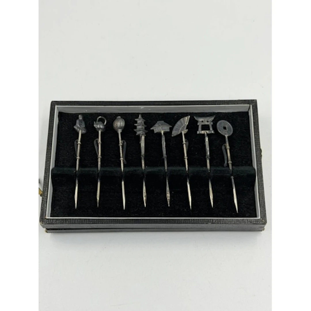 A boxed set of eight Oriental cocktail sticks, in original b...