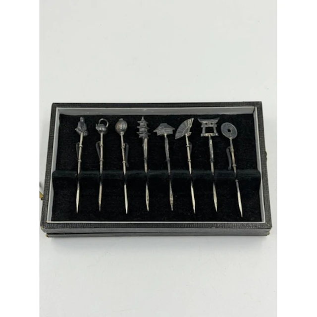 A boxed set of eight Oriental cocktail sticks, in original b...