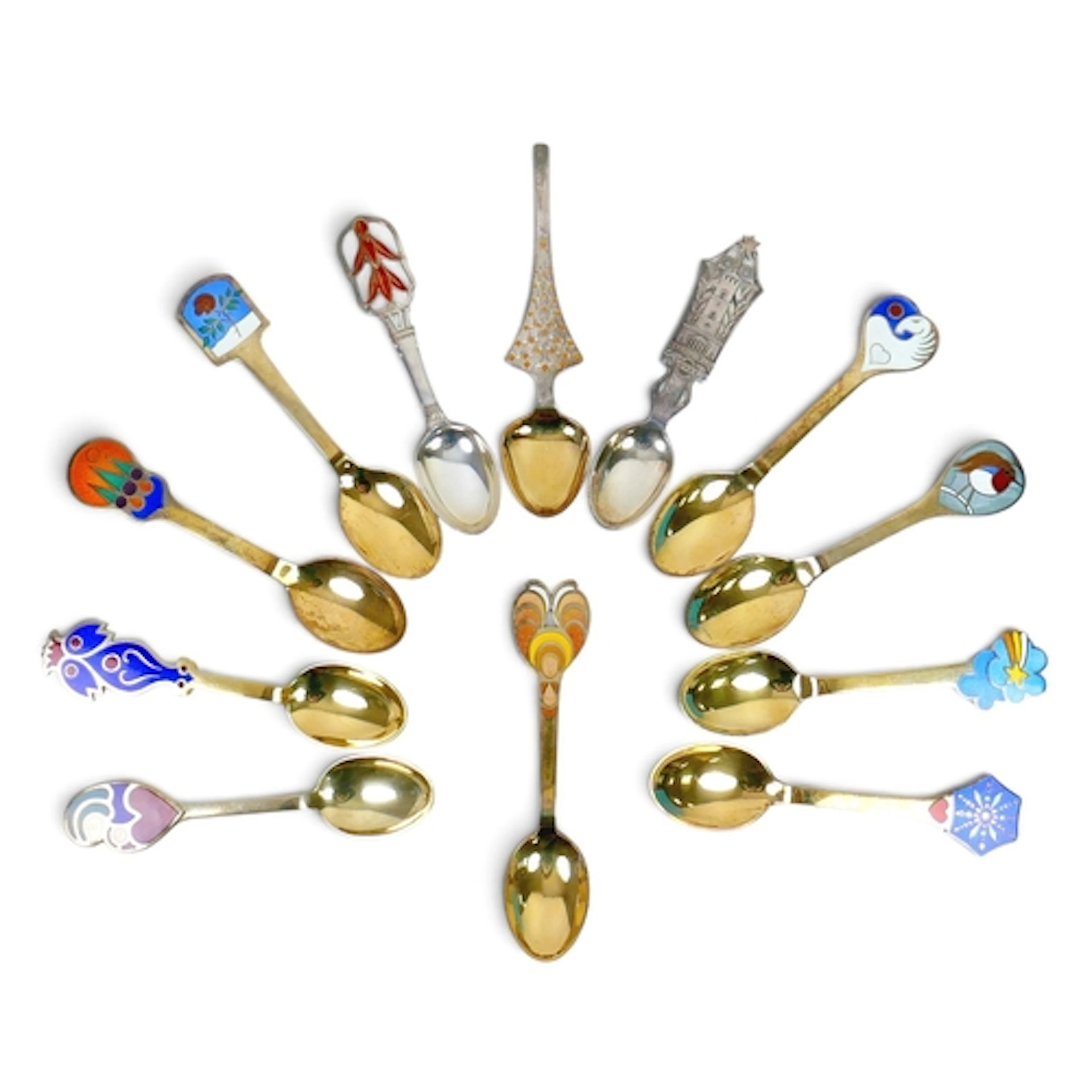 A COLLECTION OF TWELVE DANISH SILVER GILT AND ENAMEL SPOONS....