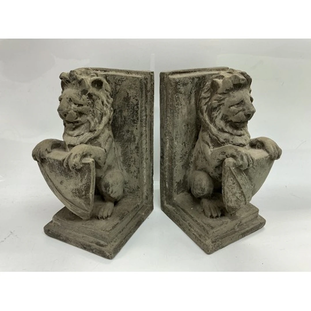 A pair of bookends in the form of lions with shields, approx...