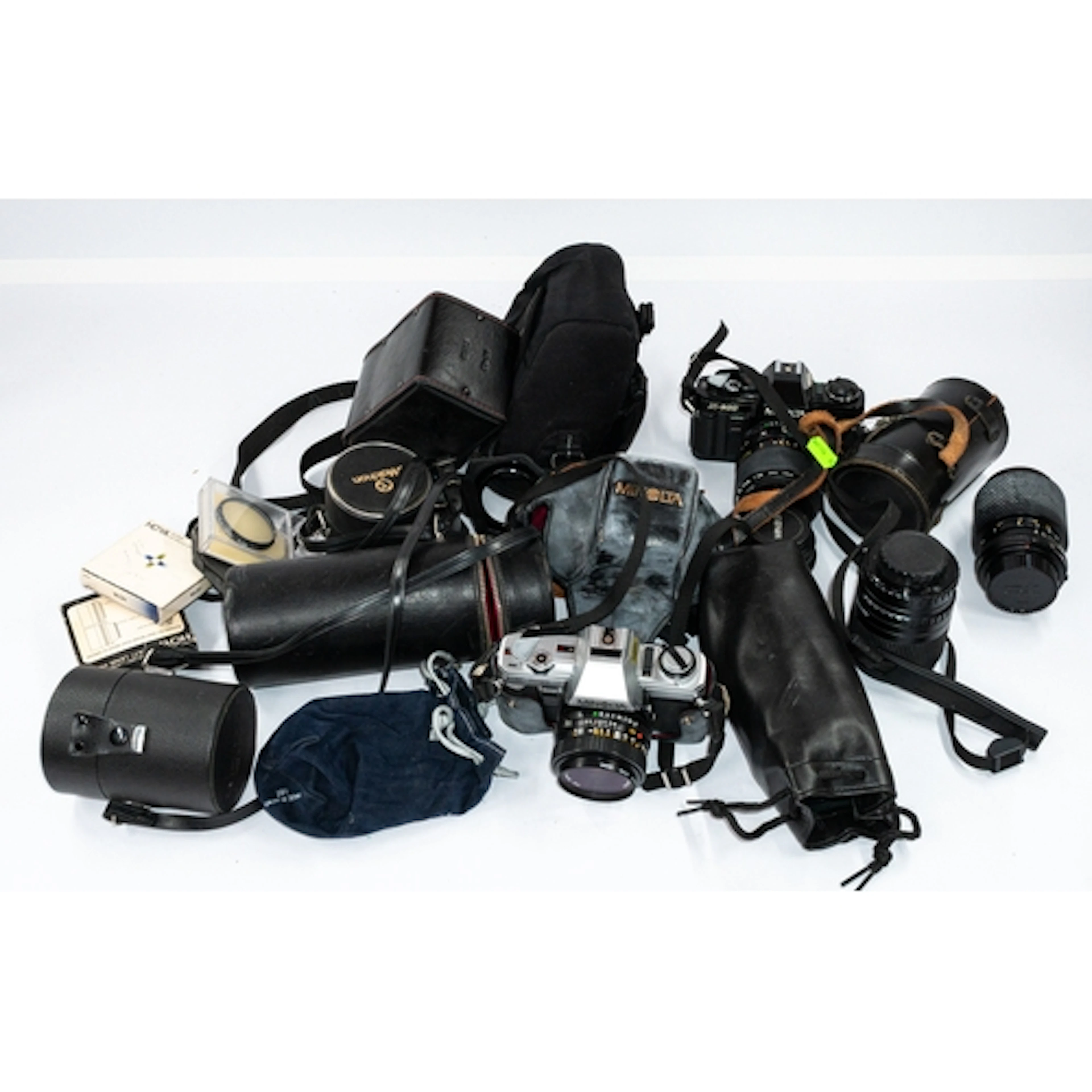 Cameras: a Minolta X-300 camera, another, together with a gr...
