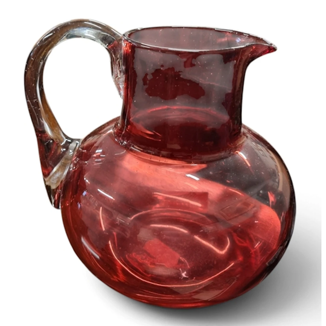 A good antique Cranberry glass water Jug in very good condit...