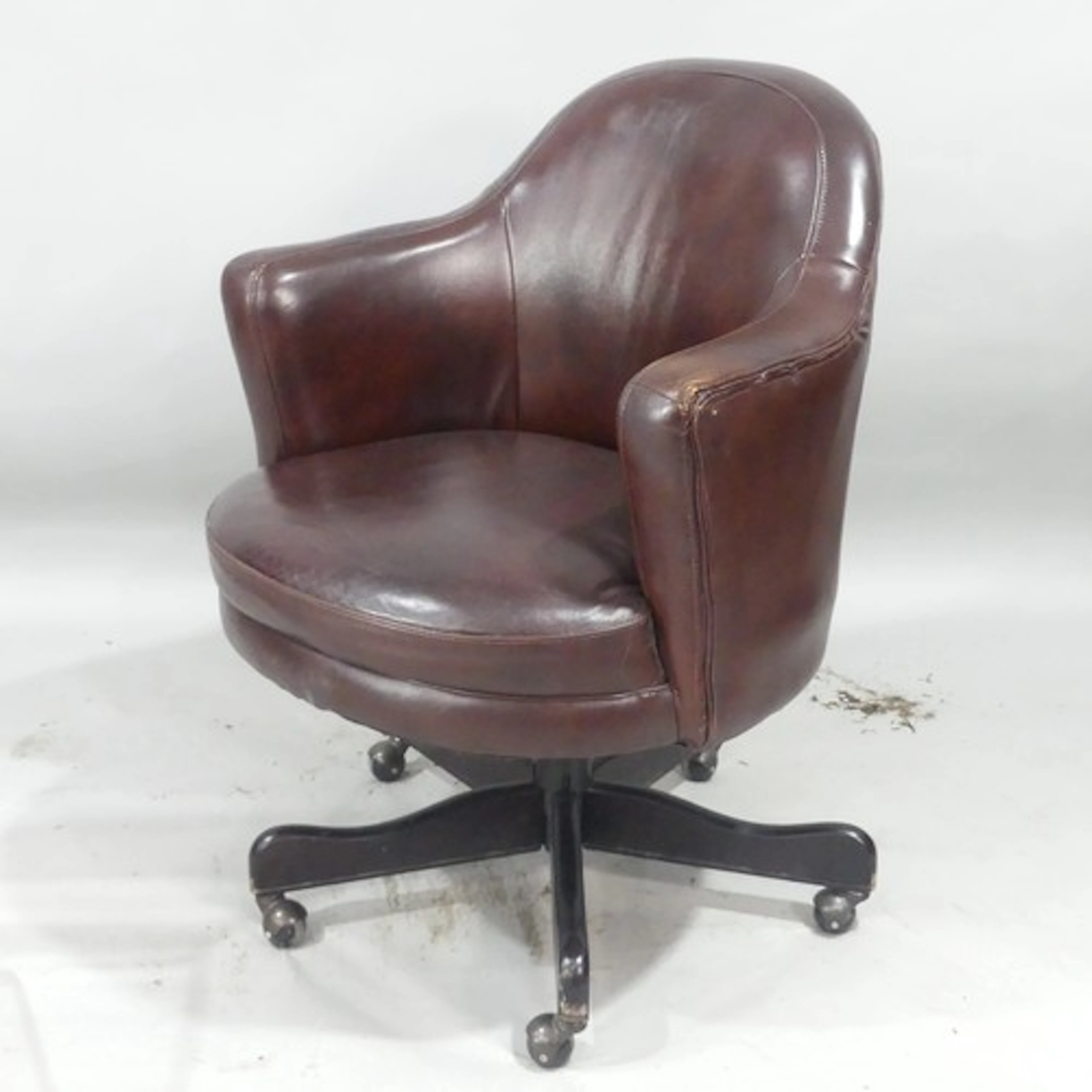 A late 20th century brown leather swivel Desk Chair, retaile...