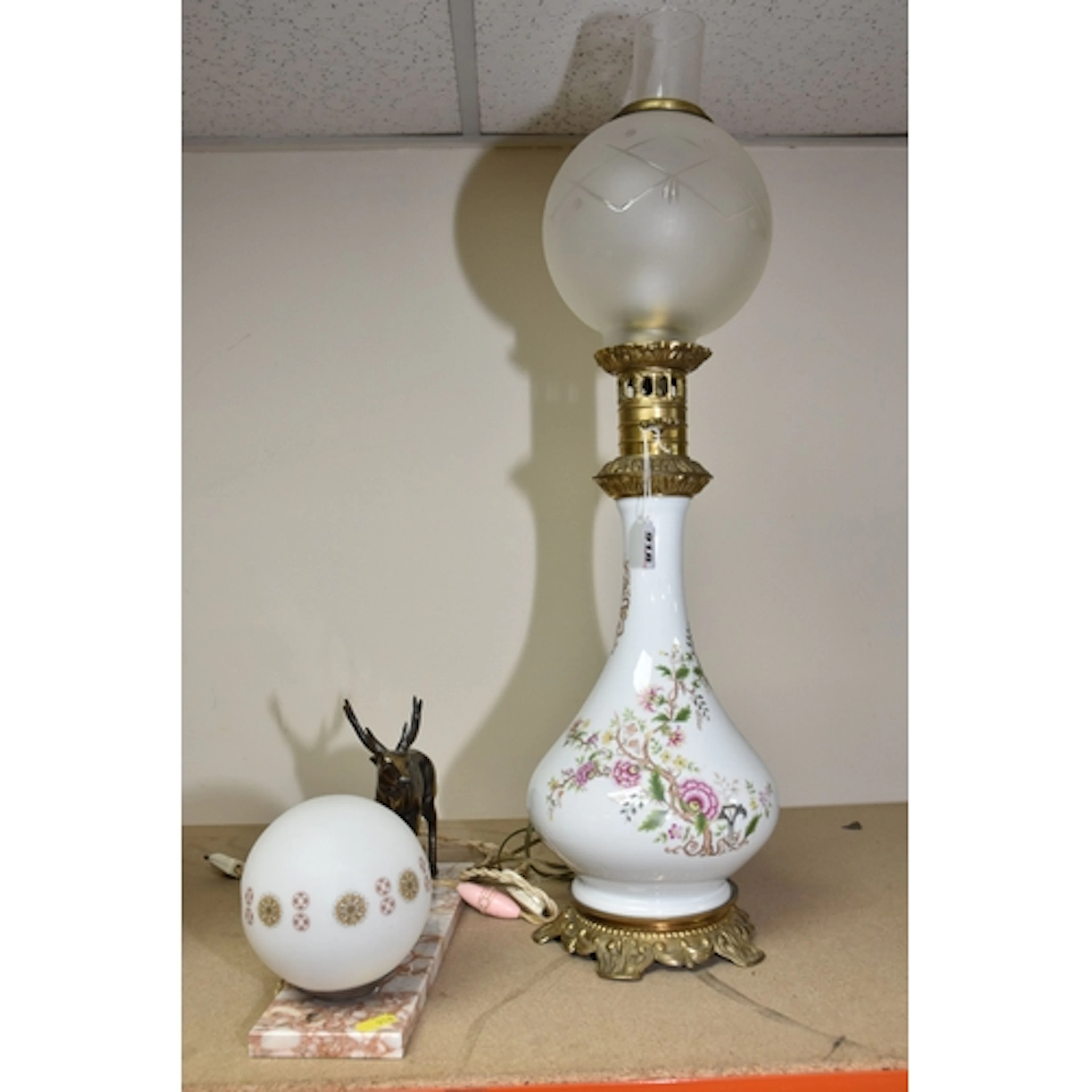 TWO TABLE LAMPS, comprising a tall reproduction oil lamp sty...