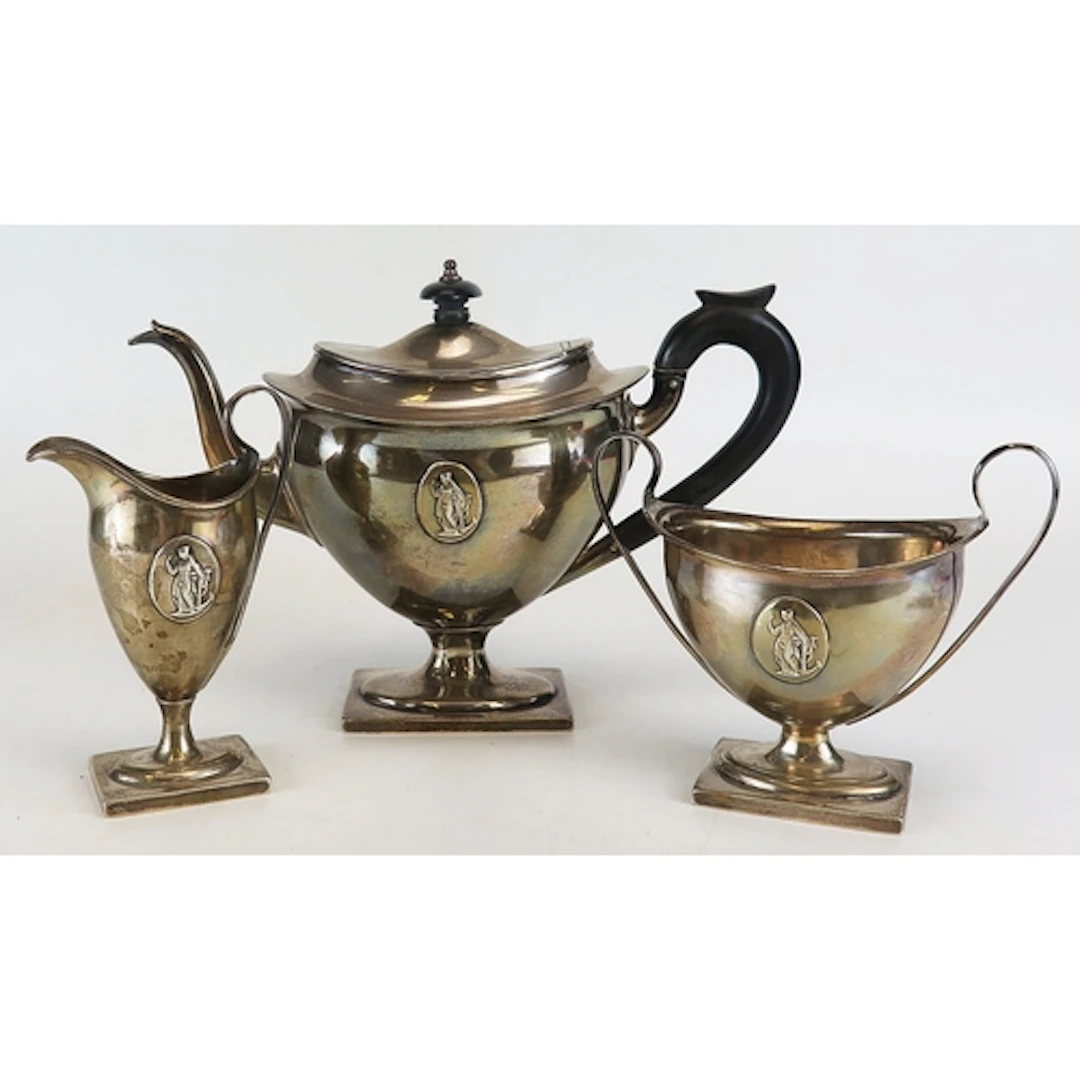 An Edward VII silver three piece tea set, maker Thomas Bradb...