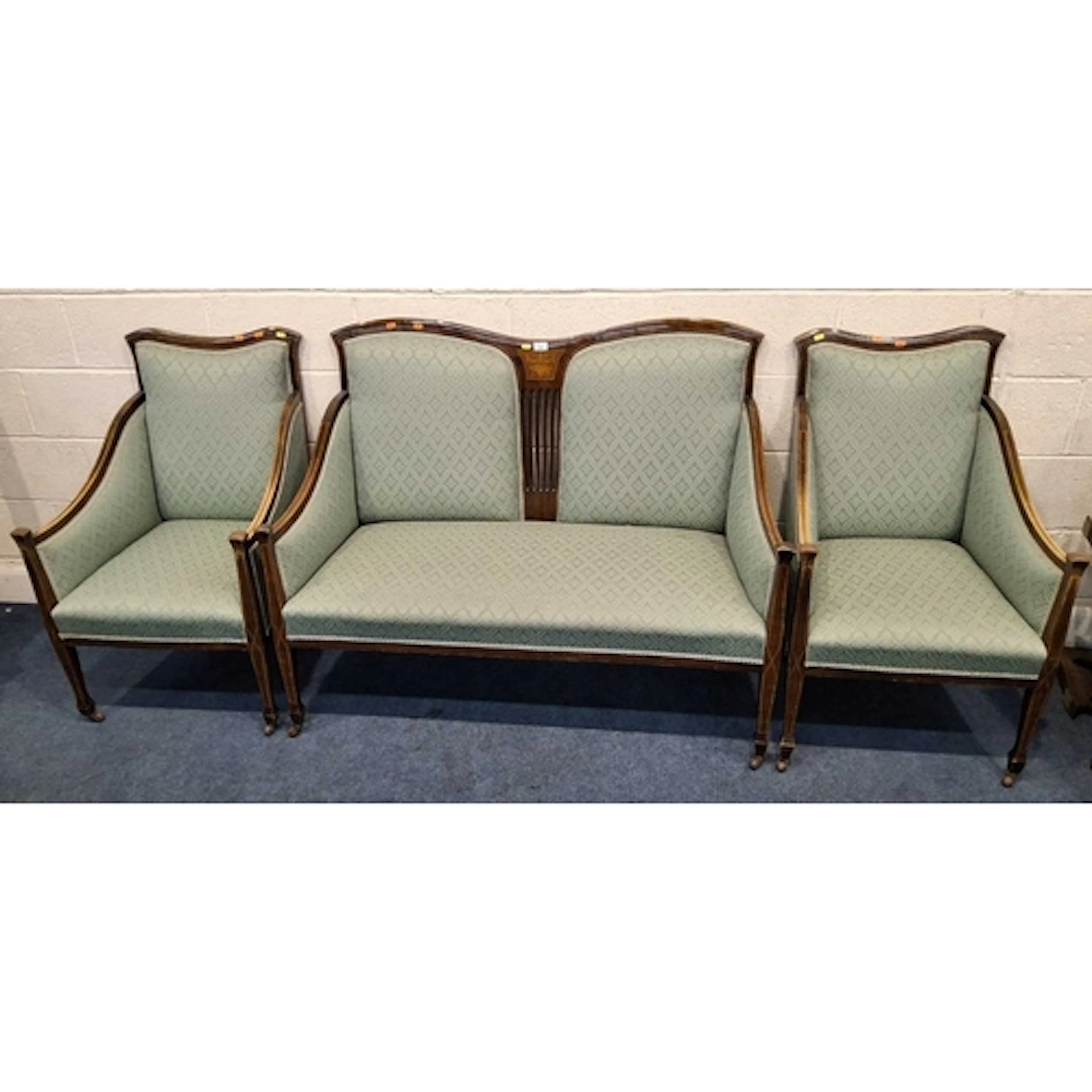 AN EDWARDIAN MAHOGANY FRAMED THREE PIECE LOUNGE SUITE, with ...