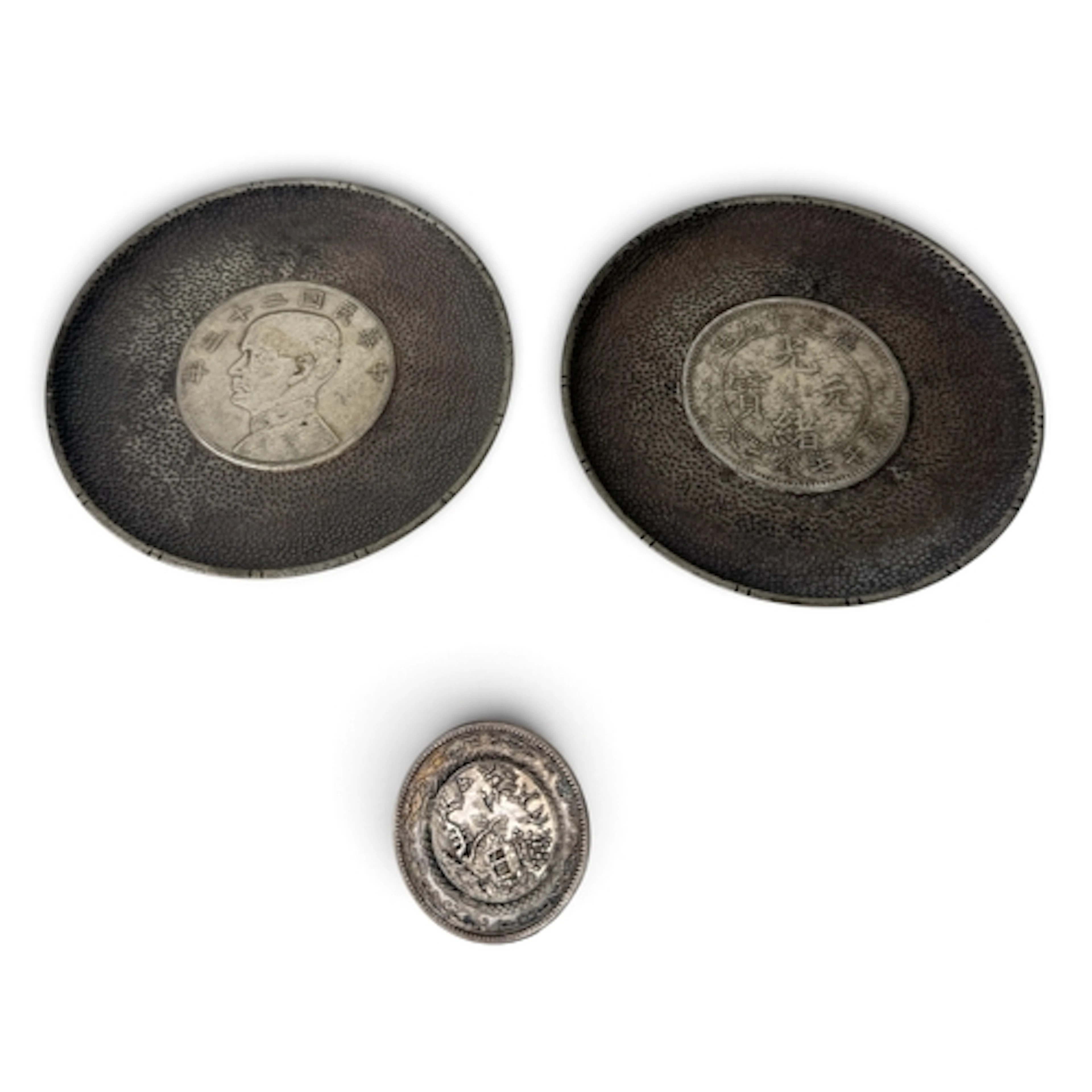 TWO CHINESE SILVER COIN DISHES AND A SILVER BROOCH Gross wei...