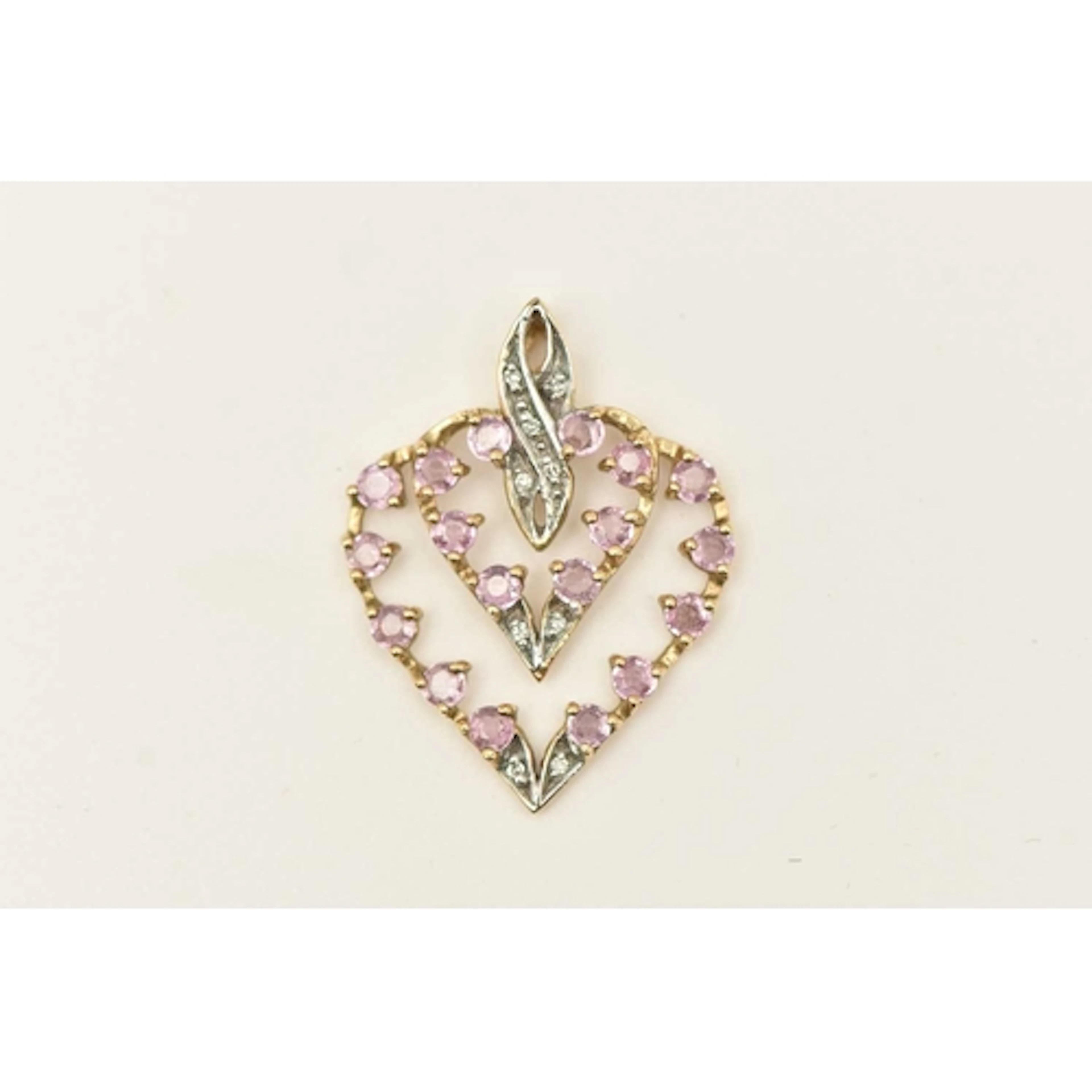 A 9CT YELLOW GOLD GEM SET PENDANT, an open work heart pendan...