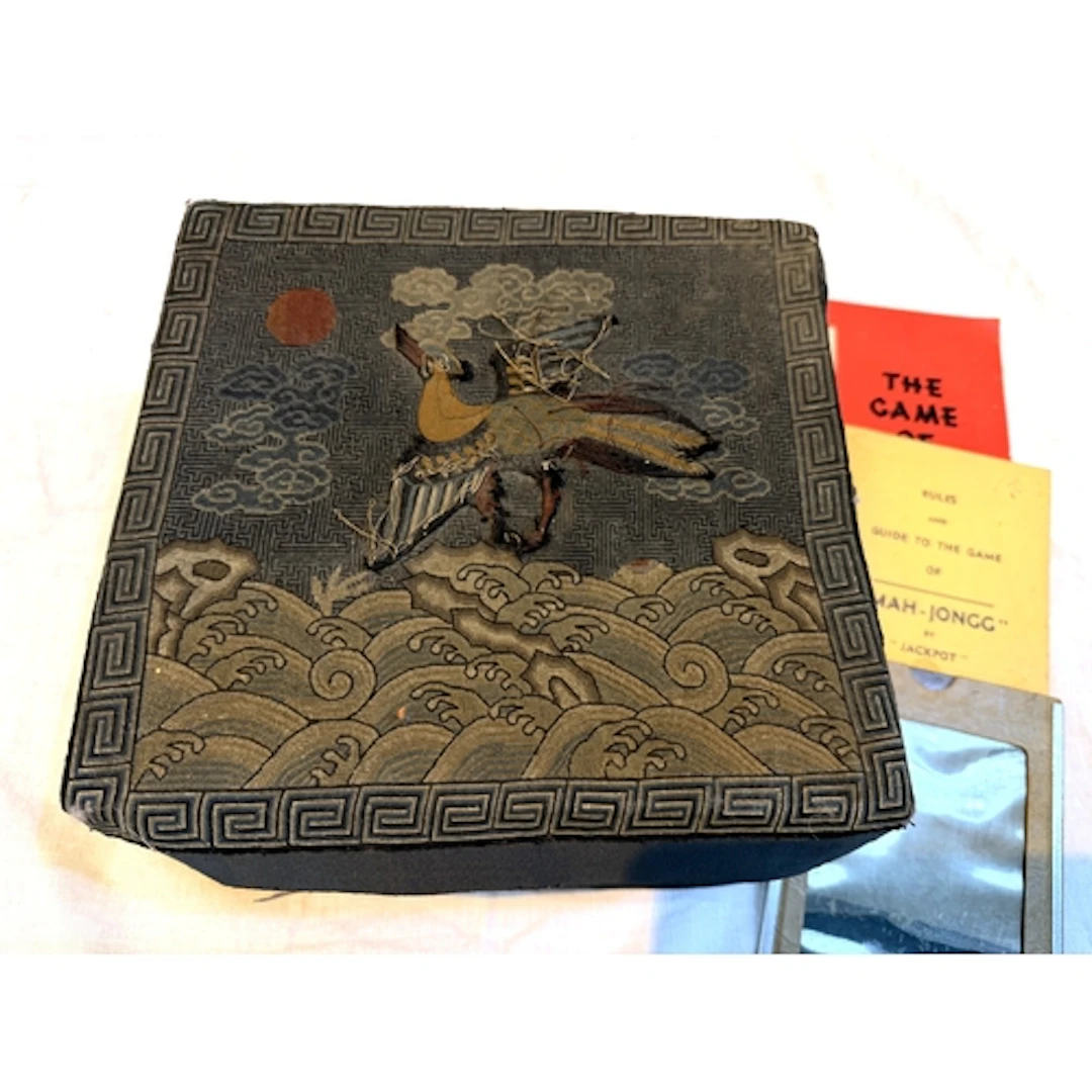 A Chinese square silk box wit applied bird to the top above ...