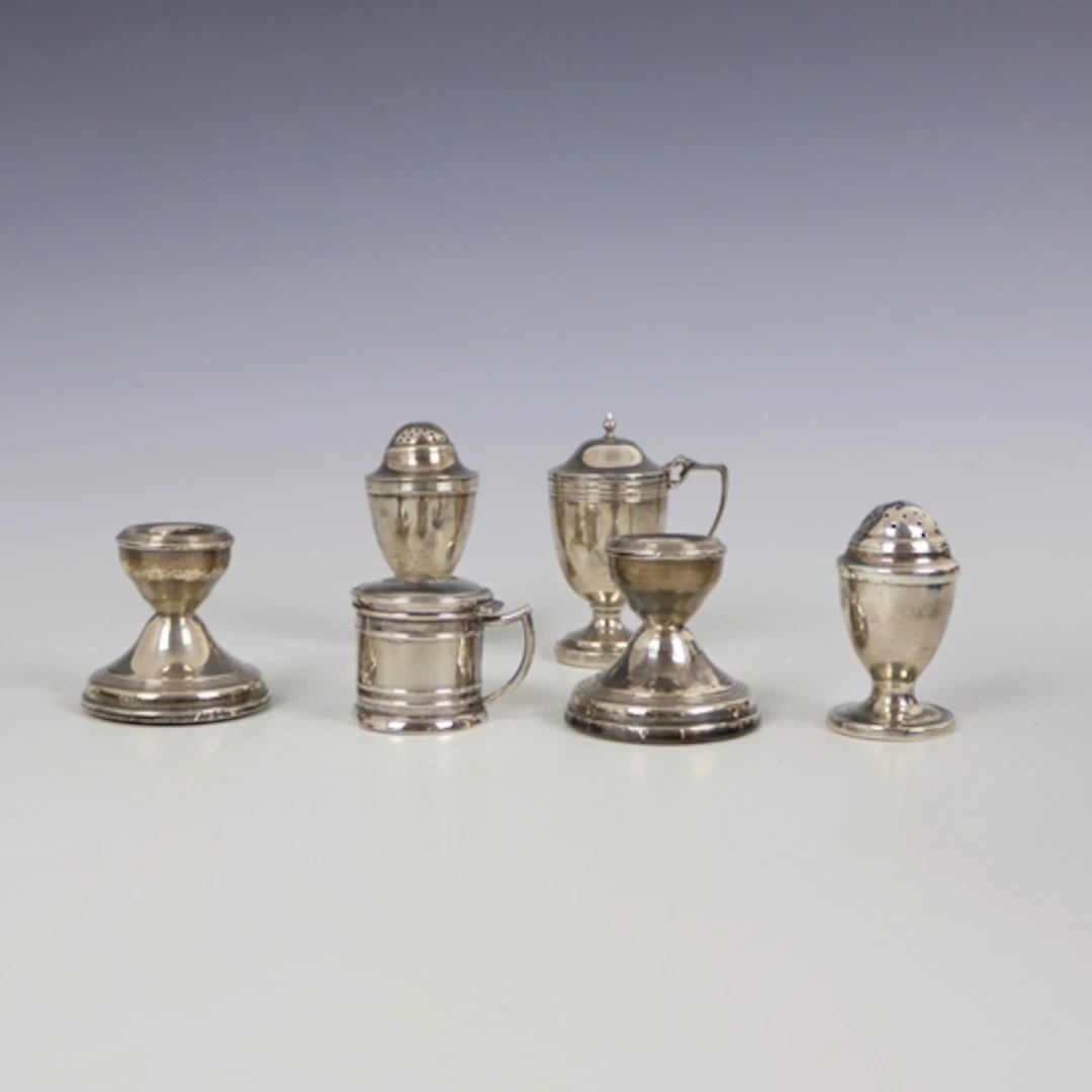 A selection of silver, including a George III silver peppere...