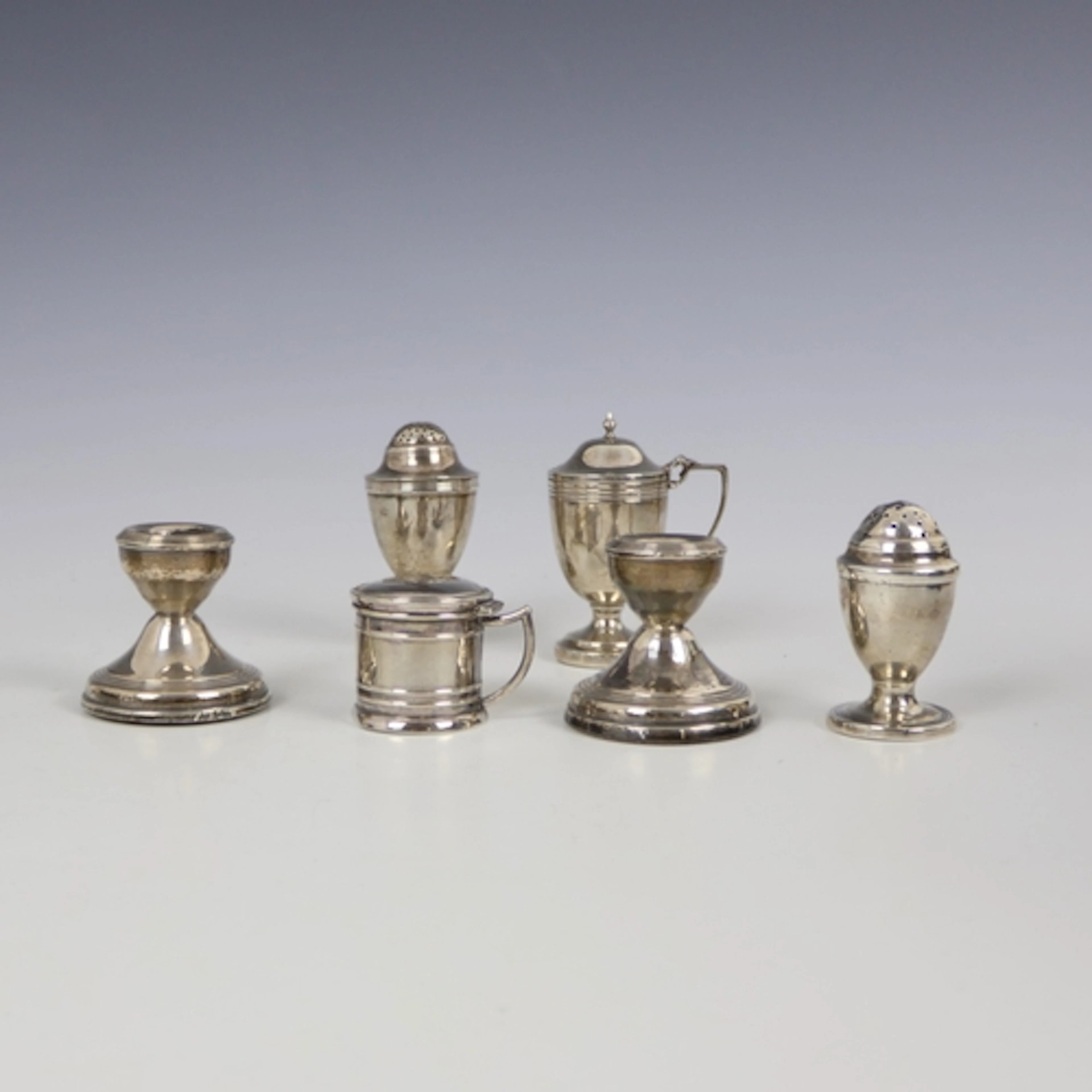 A selection of silver, including a George III silver peppere...