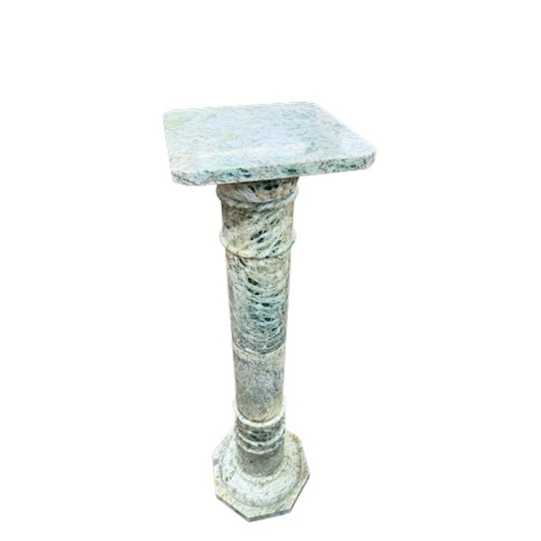 A tall carved marble or serpentine column / torchiere stand,...