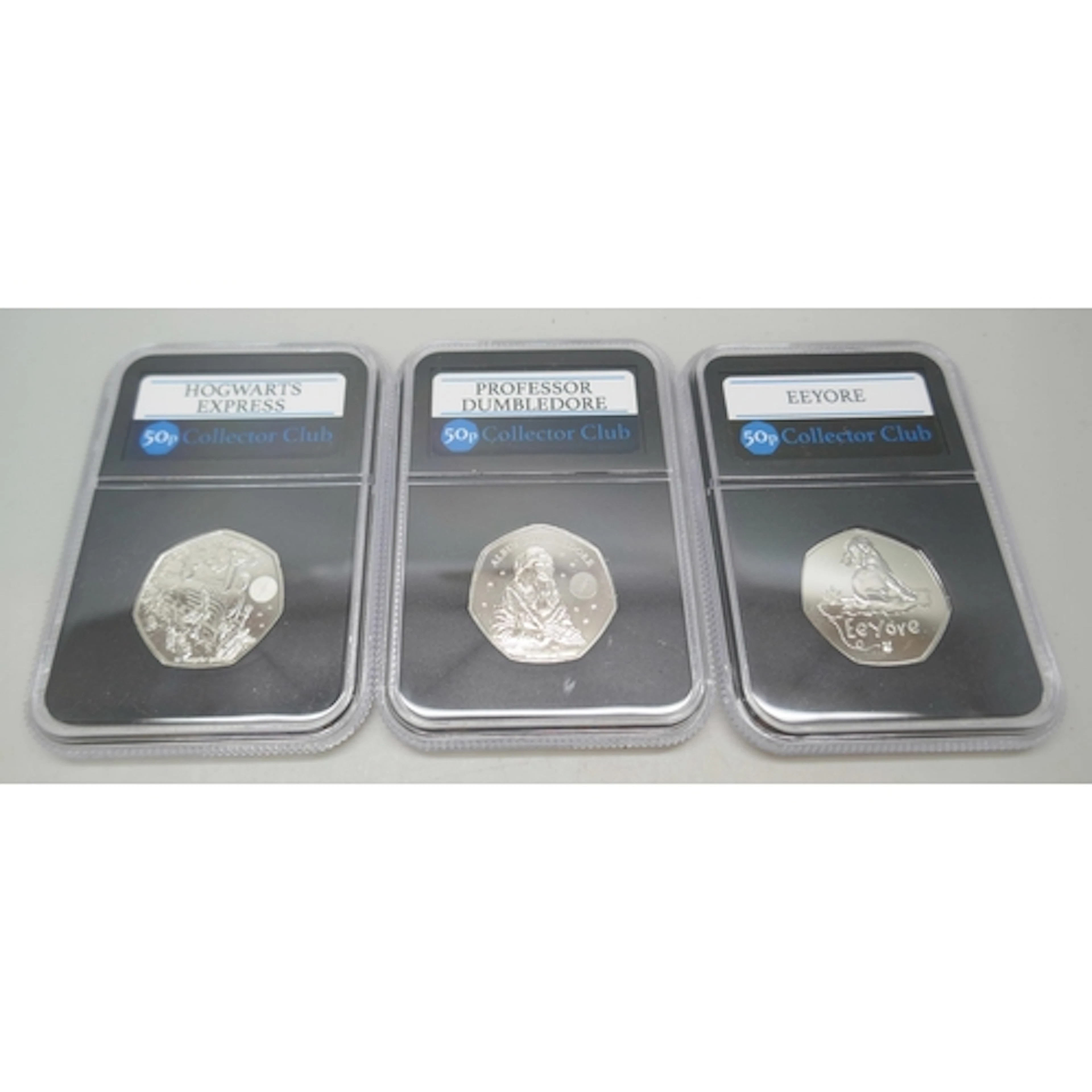 Three 50p Collector Club coins - Eeyore, Professor Dumbledor...