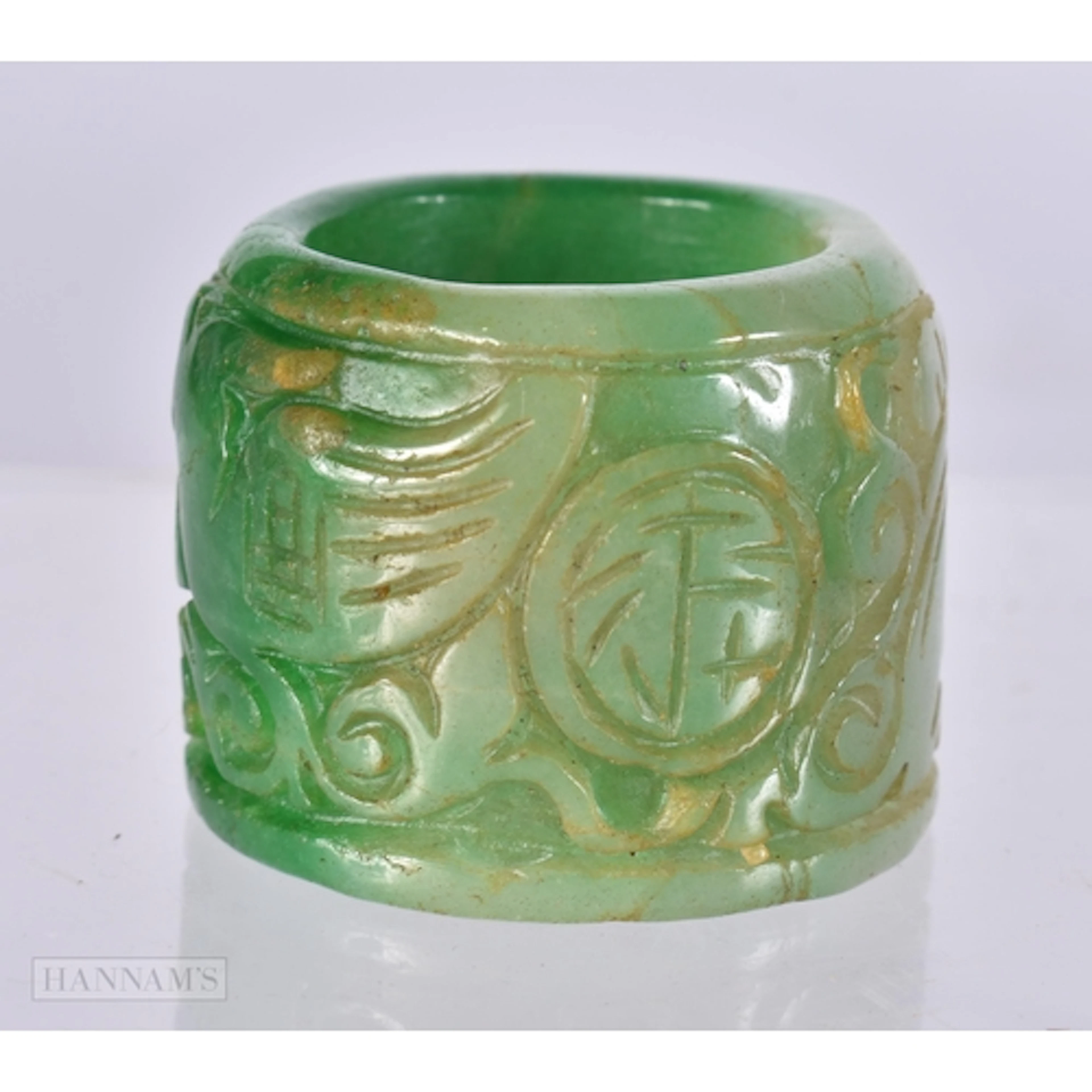 A TWO TONE JADE ARCHERS RING. size z