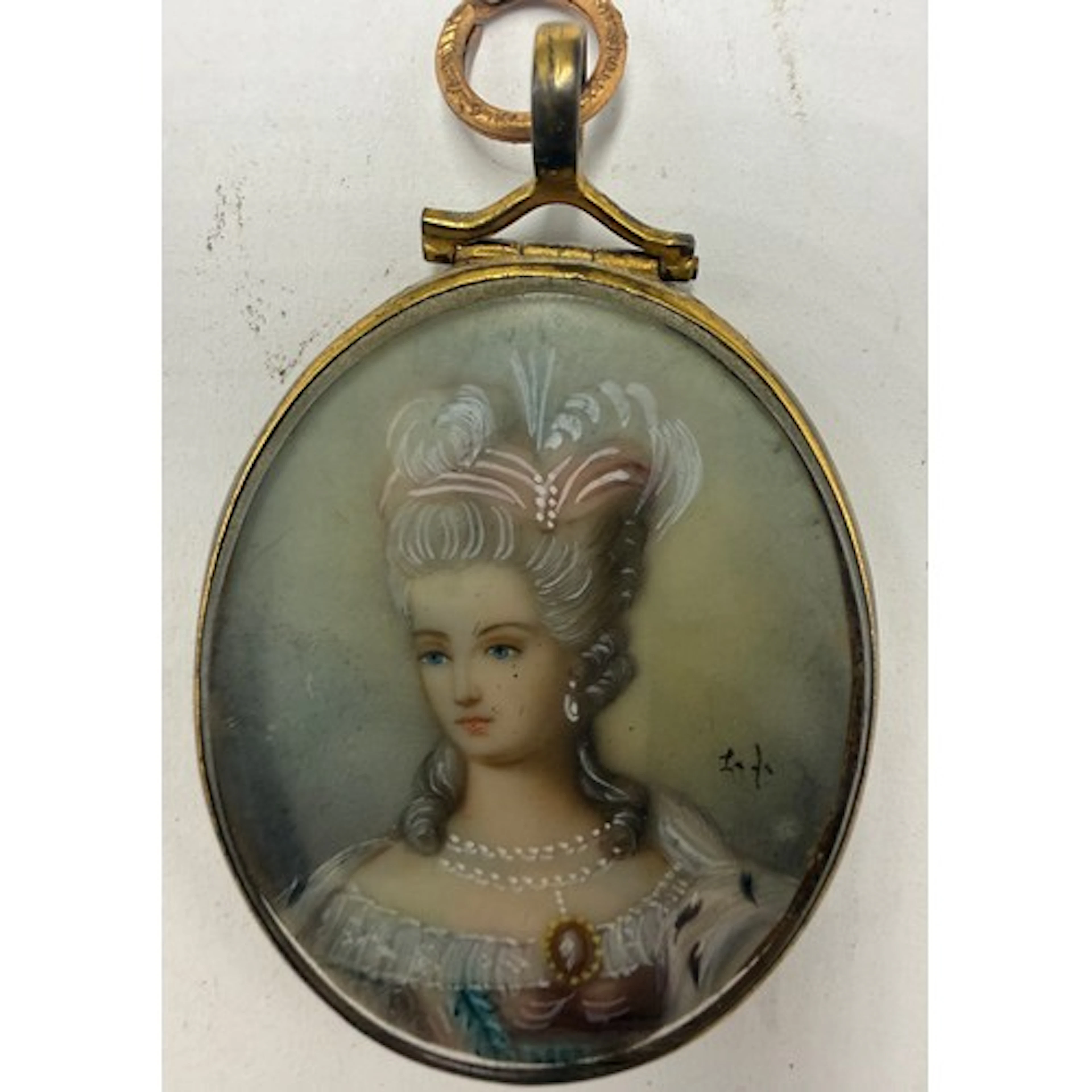 An ivory portrait miniature of a French lady with ornate hea...