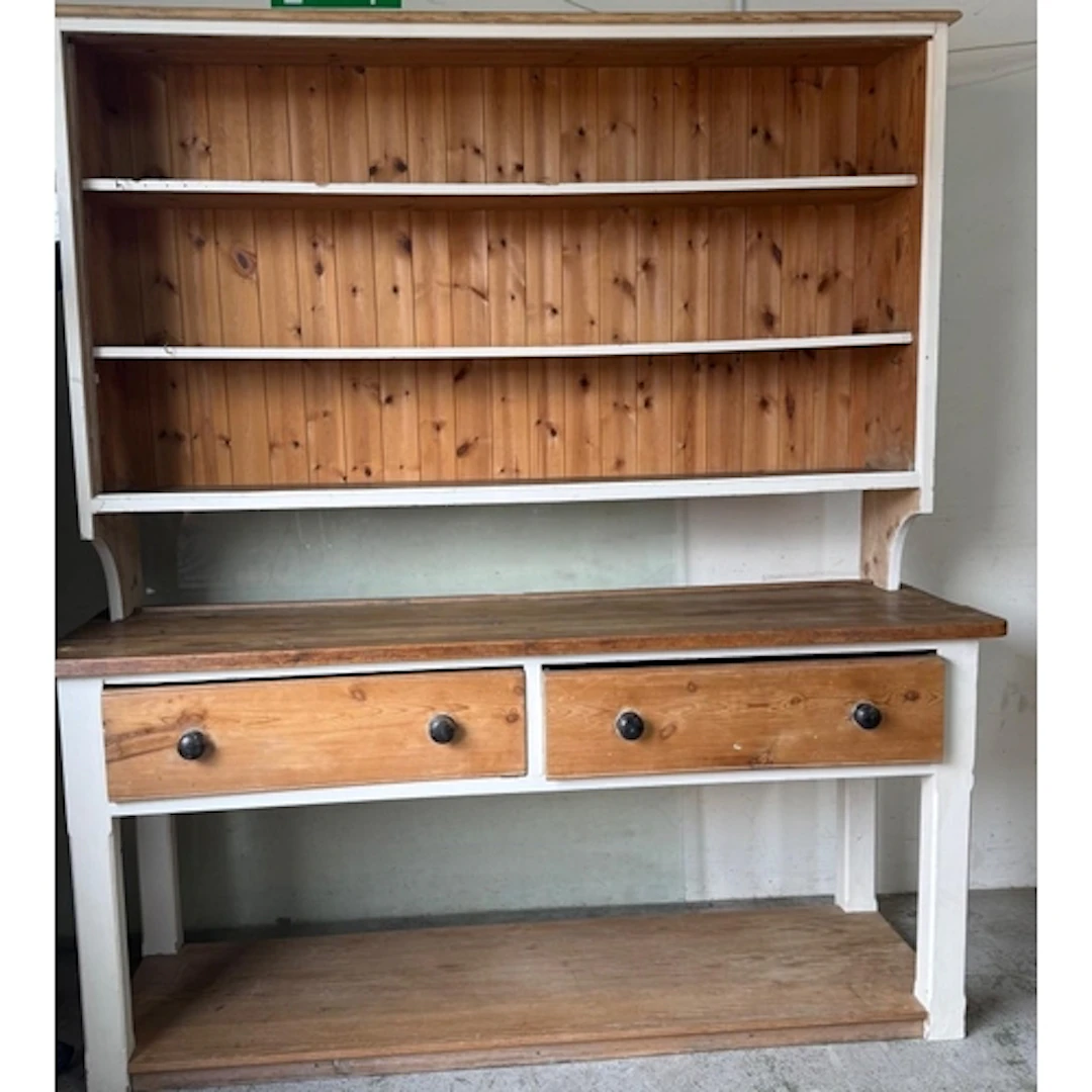 A striped pine and white painted Welsh dresser with three ti...