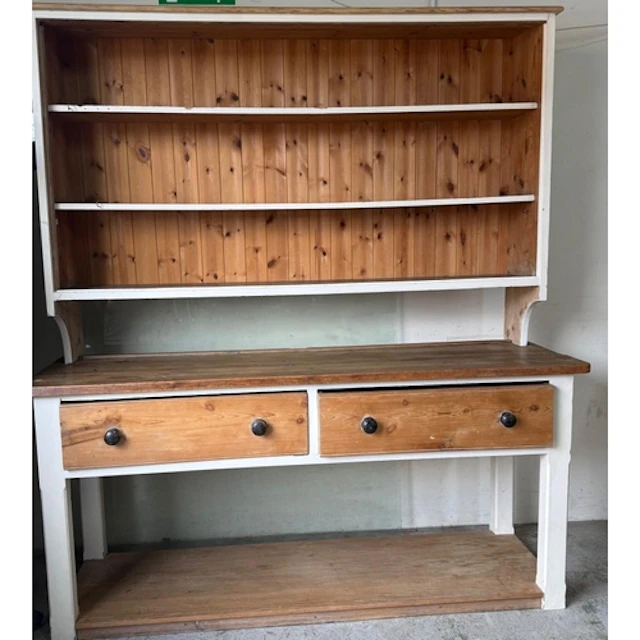 A striped pine and white painted Welsh dresser with three ti...