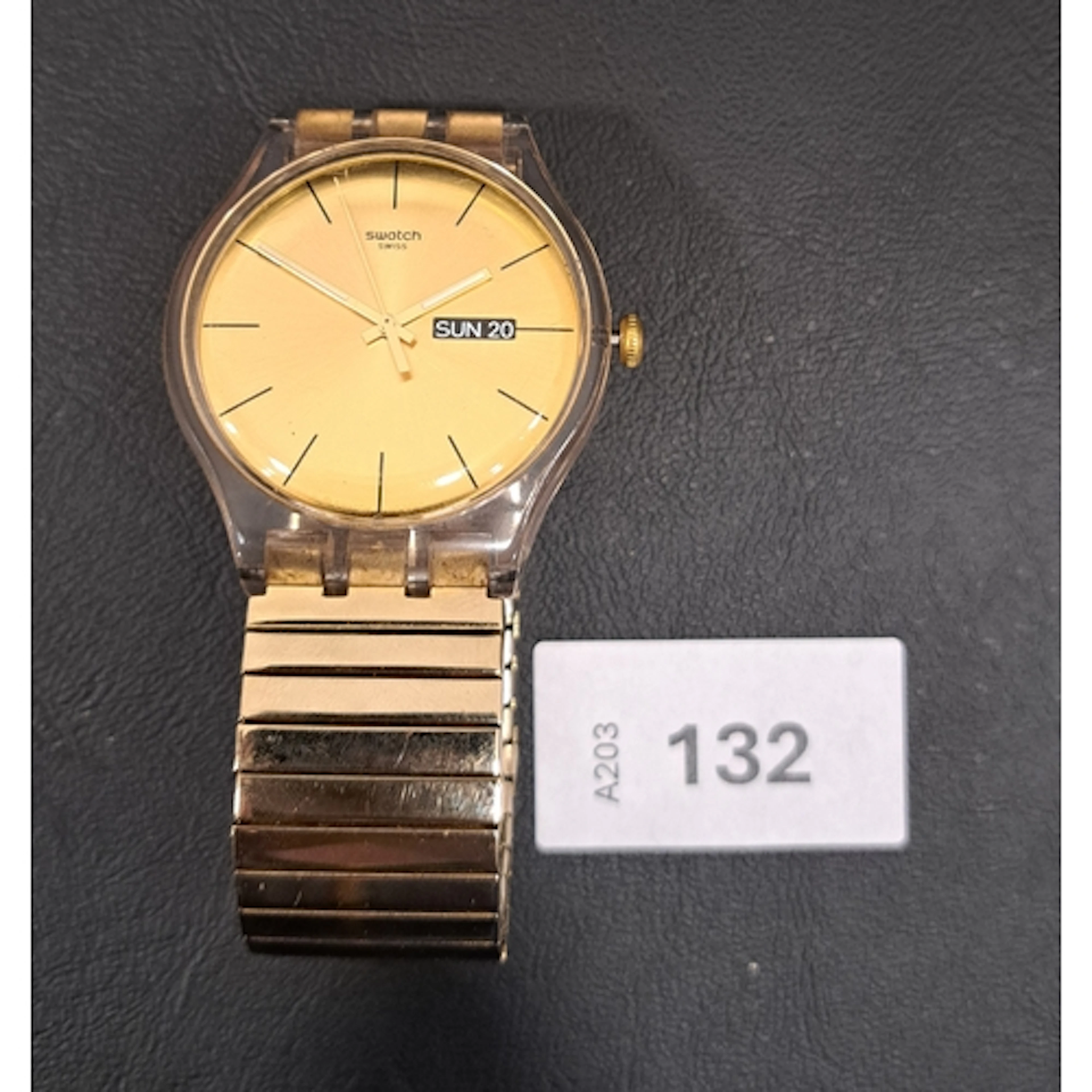 SWATCH WRISTWATCH IN GOLD TONE the gold tone face with bato...