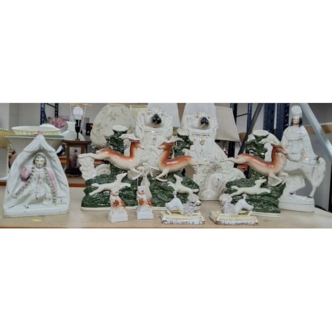 A GROUP OF STAFFORDSHIRE FIGURES, DOGS, ETC, comprising a fi...