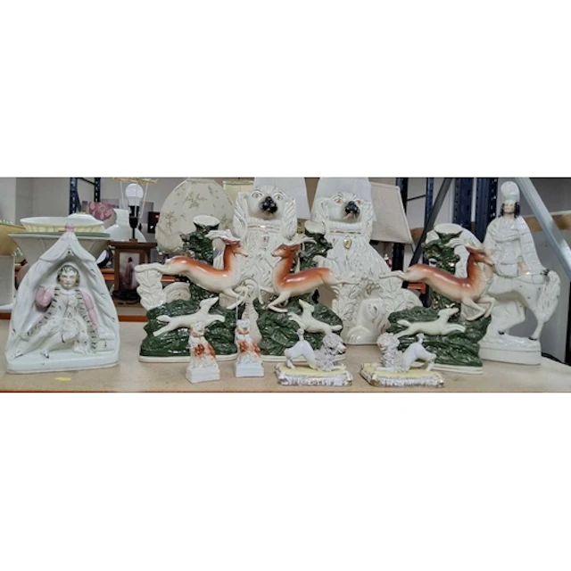 A GROUP OF STAFFORDSHIRE FIGURES, DOGS, ETC, comprising a fi...