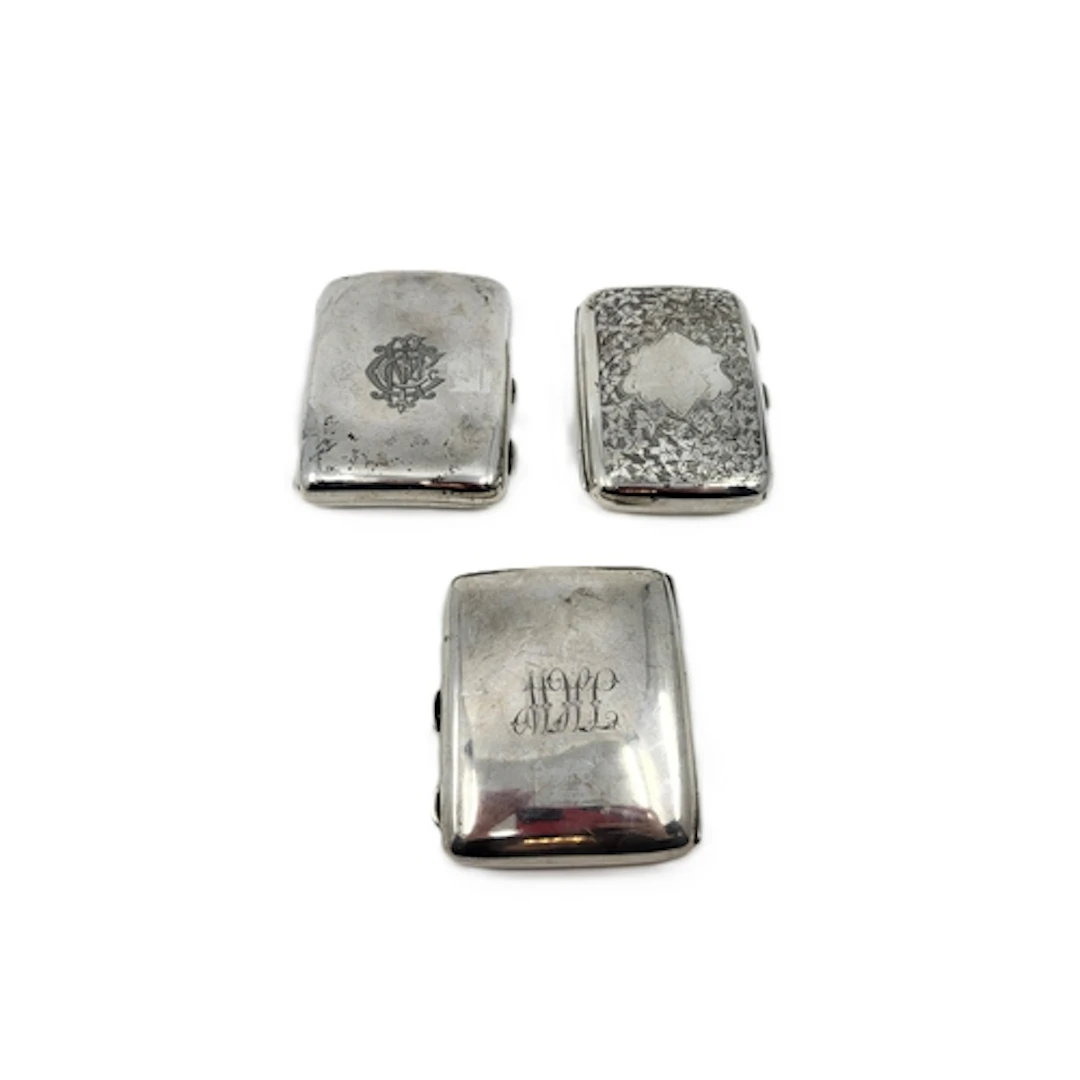 THREE ANTIQUE / VINTAGE SILVER CIGARETTE CASES, 265 g.