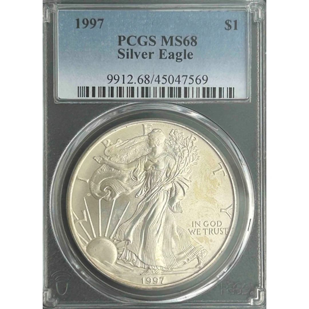 1997 USA $1 silver Eagle coin, slabbed and graded by P.C.G.S...