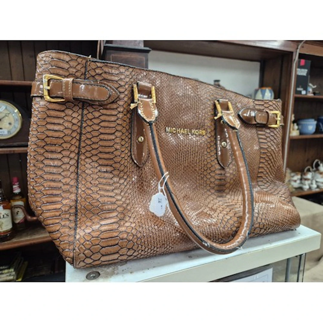 A Michael Kors brown python-embossed leather satchel.