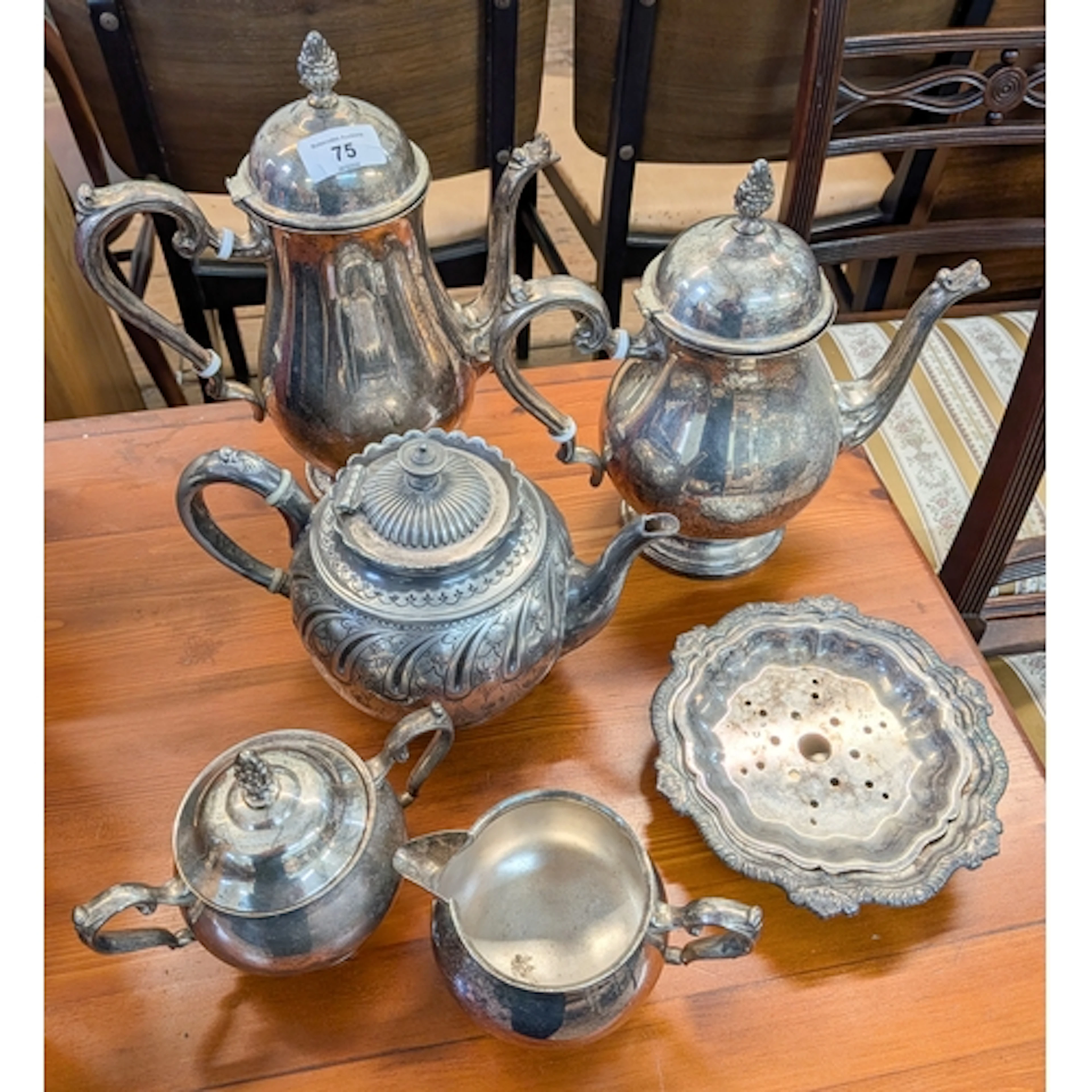 A four piece plated tea and coffee set together with a plate...