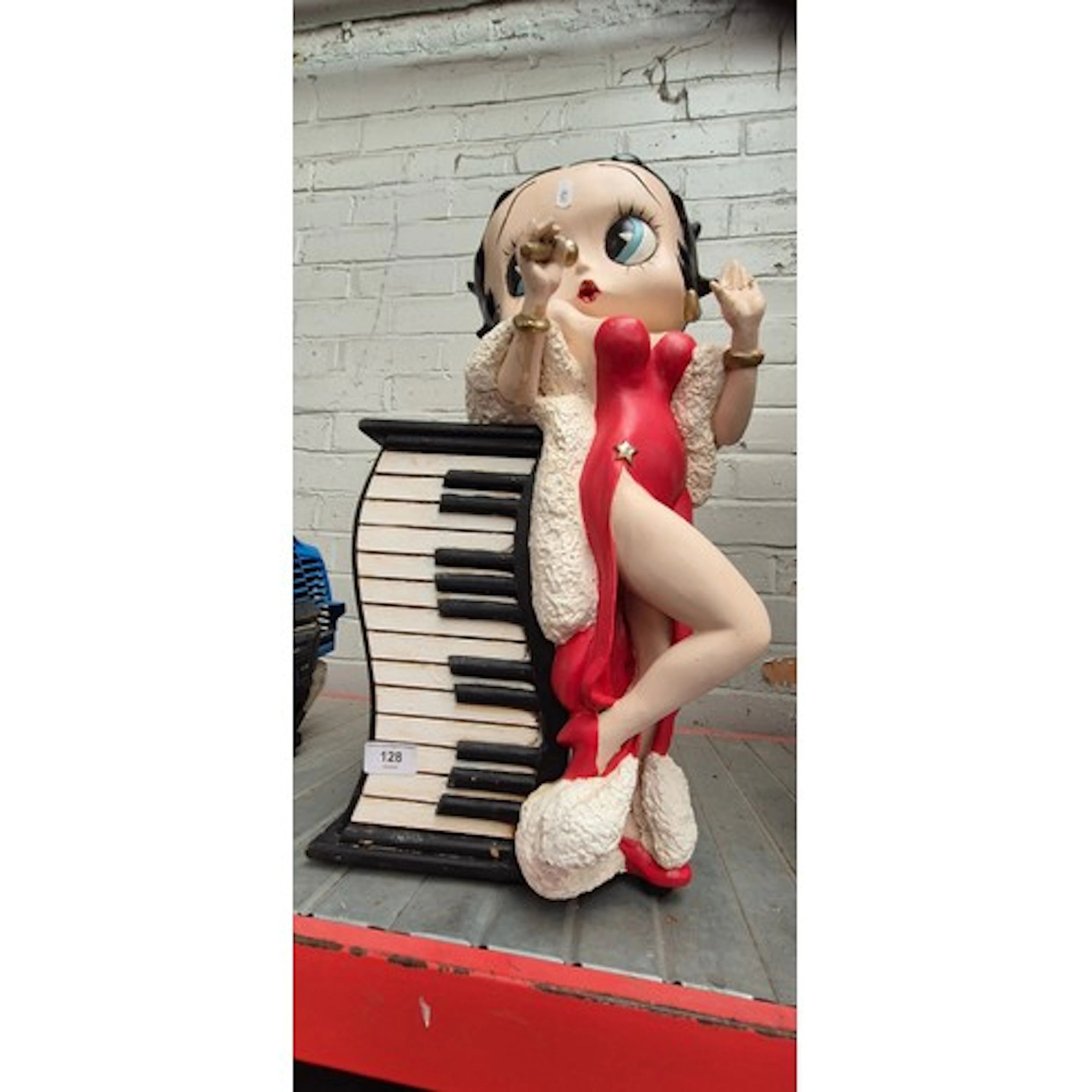A CD holder featuring a ceramic Betty Boop and keyboard (AF)