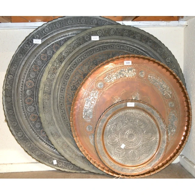 Two large Middle Eastern copper and silvered metal circular ...